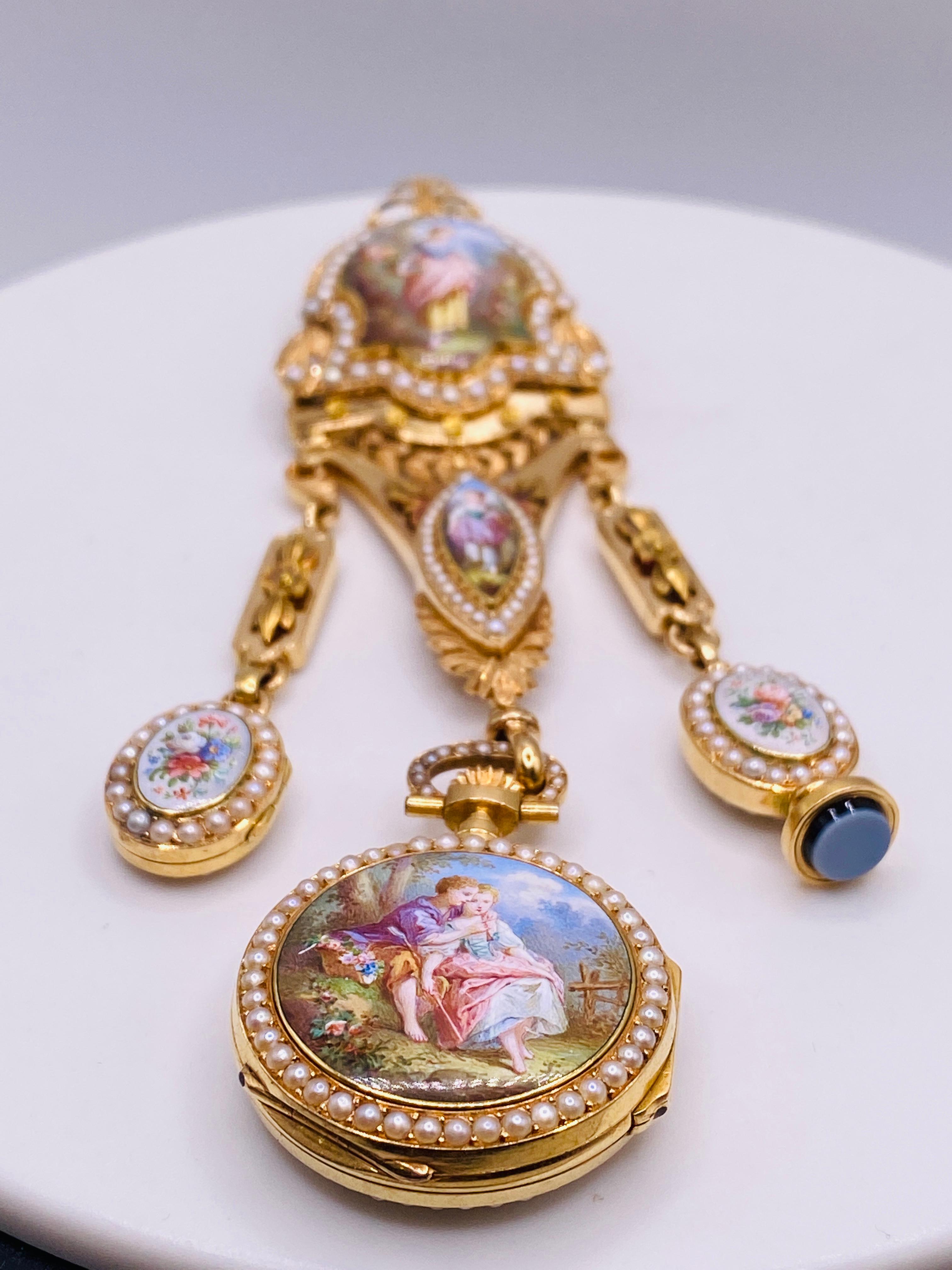 Antique early 19th century enamel and seed pearl 14k yellow gold pendant watch. Previous lapel pin removed and hidden bail placed for wearing as a pendant. Length from bail to bottom of watch is 125mm, width is approx. 30 mm. 41.1Dwt