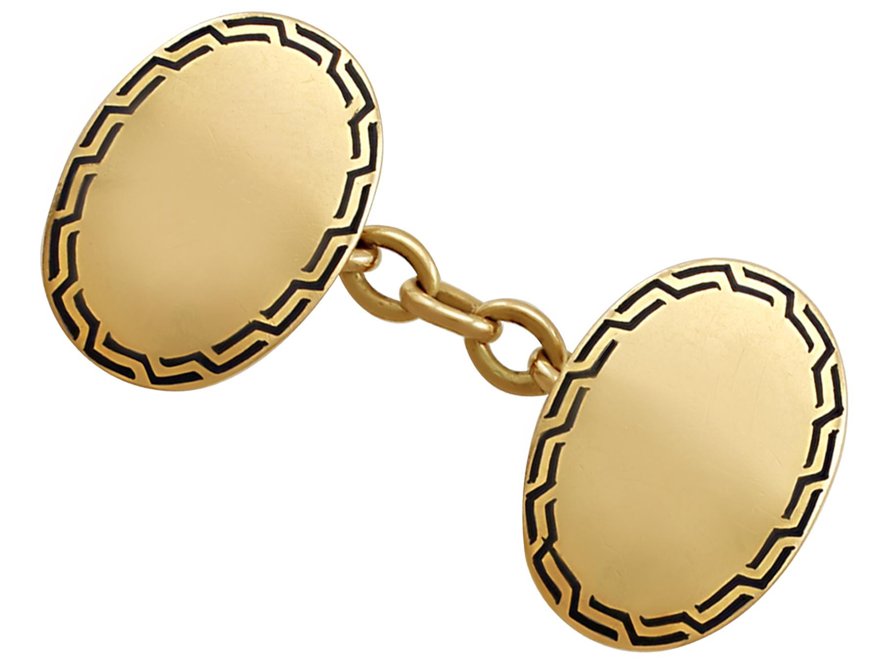 A fine and impressive pair of antique enamel and 15 karat yellow gold cufflinks; an addition to our men's jewelry and estate jewelry collections.

These antique cufflinks have been crafted in 15k yellow gold.

The cufflinks have an oval form.

The
