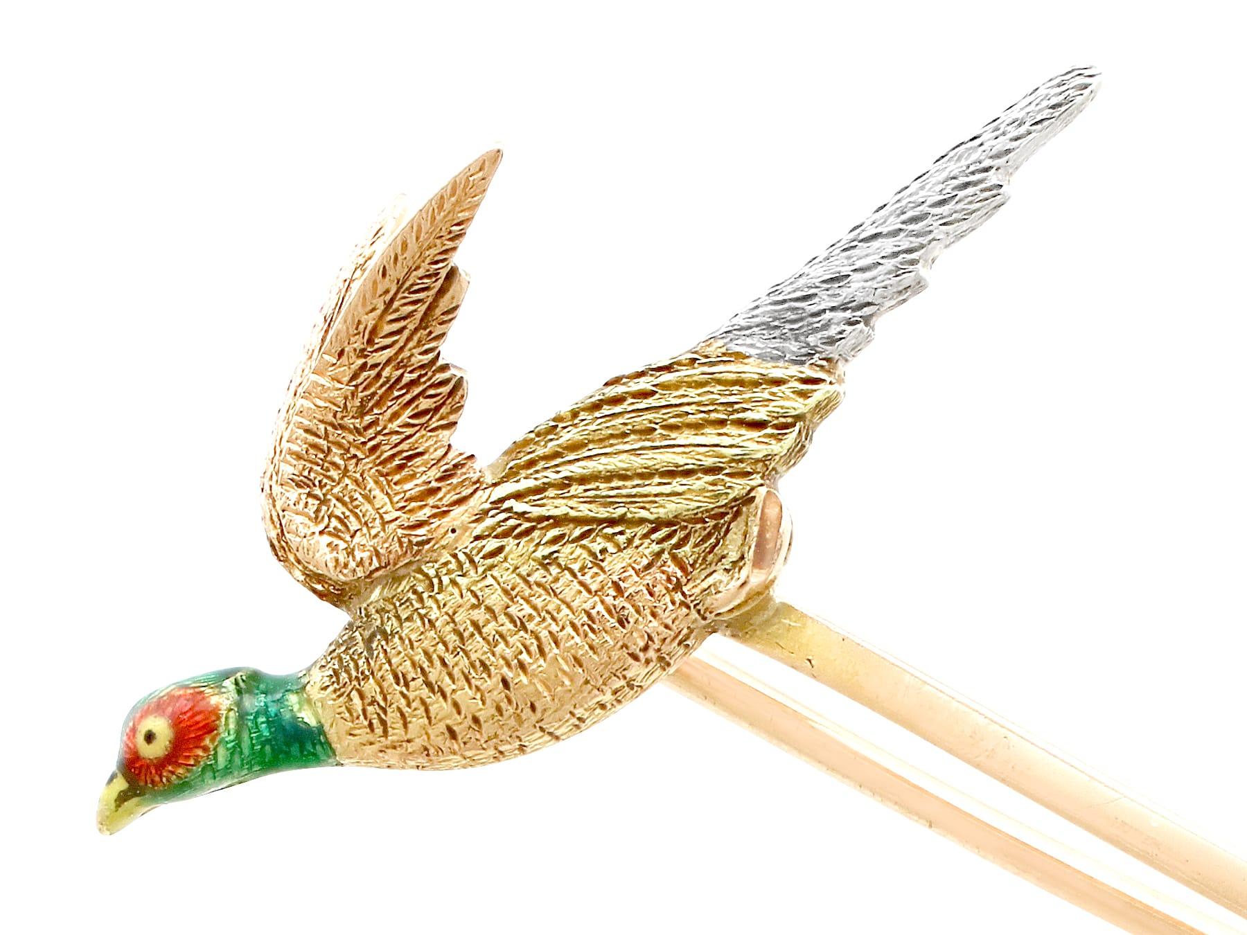 An exceptional, fine and impressive enameled pheasant bar brooch in platinum and 15 karat yellow gold; part of our antique jewelry and estate jewelry collections.

This exceptional, fine and impressive antique bar brooch has been crafted in 15k