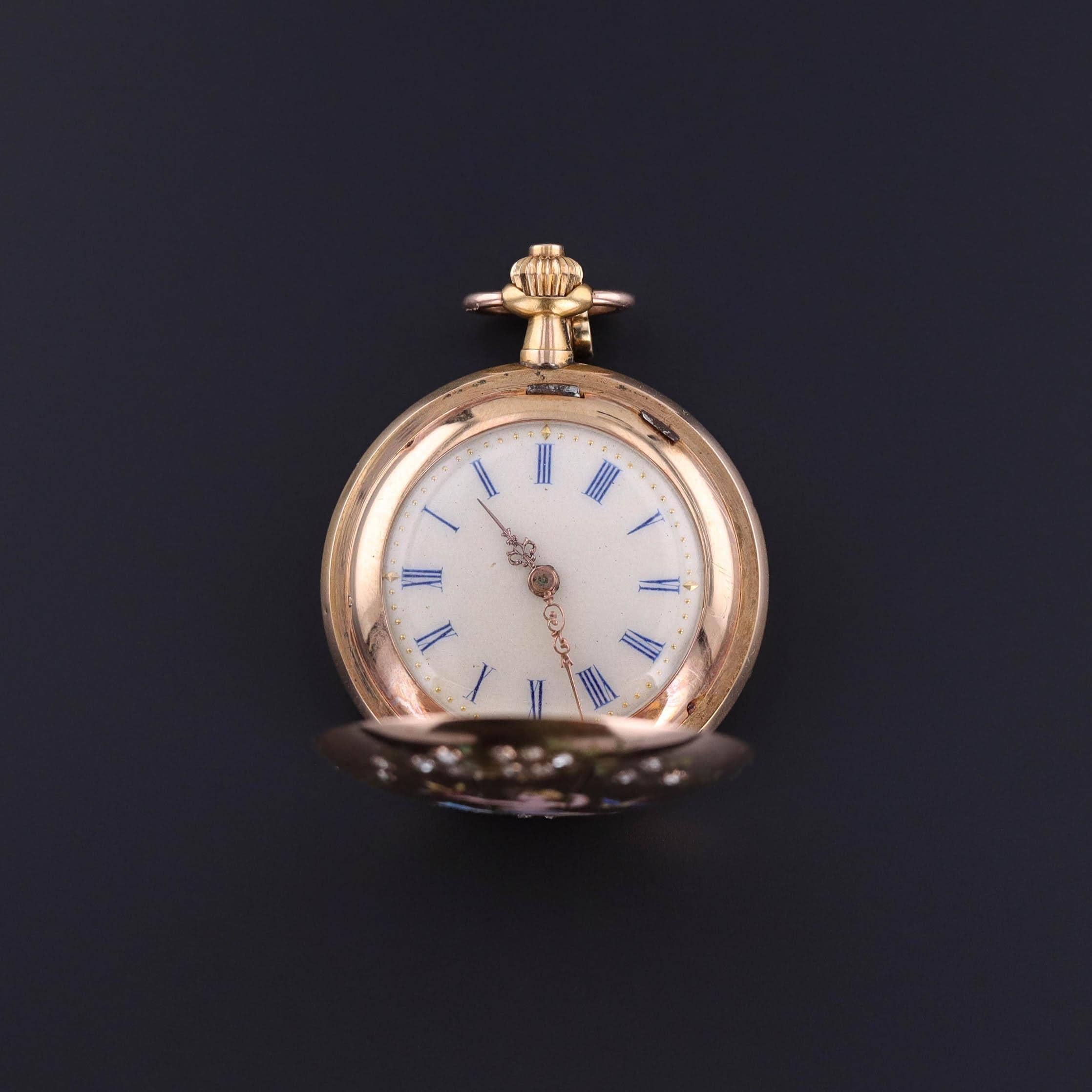 Exquisite Antique Pocket Watch: This exceptional French pocket watch, crafted in 18k gold, is a true treasure from the late 19th century (circa 1880-1890). The highlight of this piece is an enamel scene featuring a cherubic child draped in a cloth,