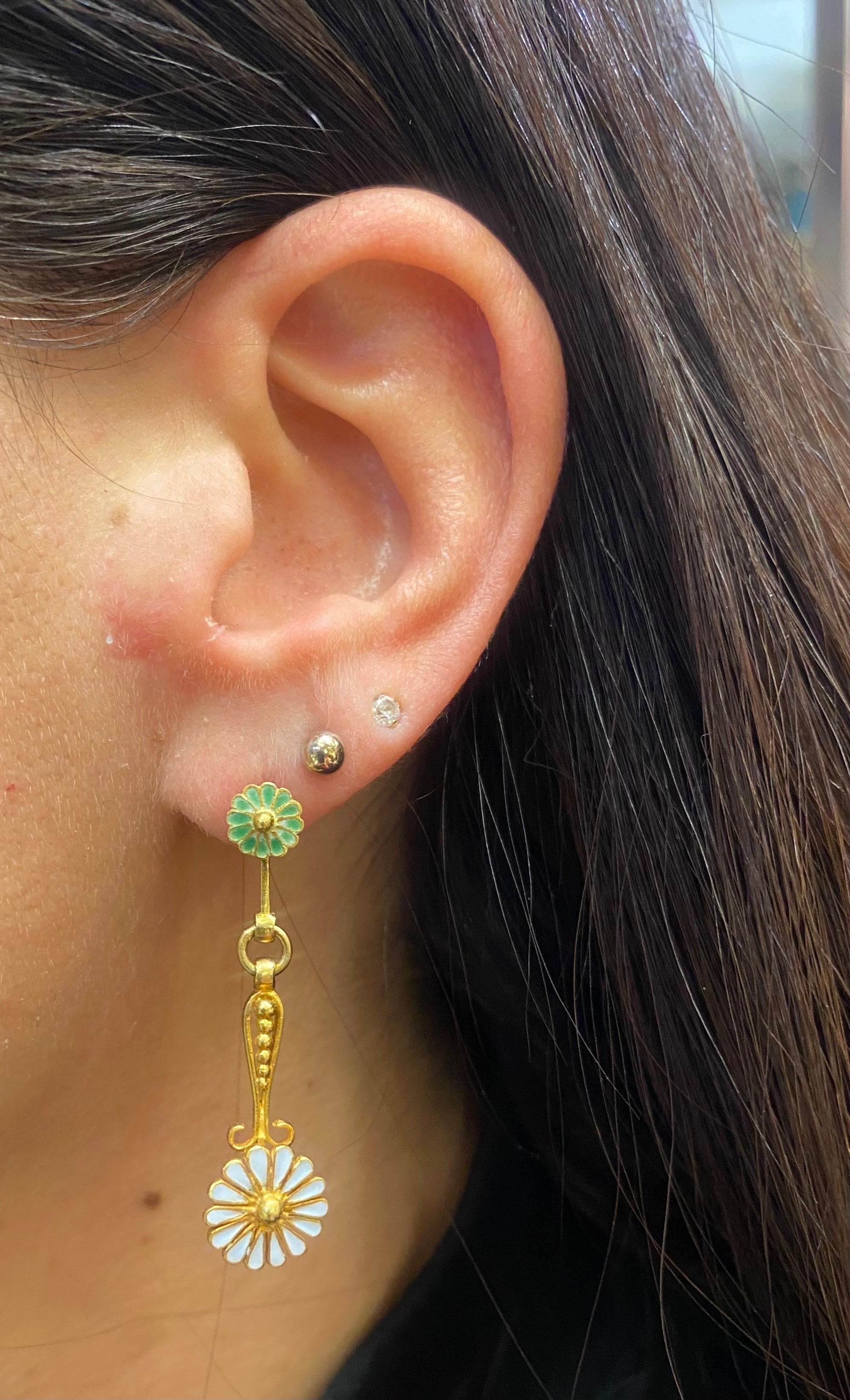 Antique Enamel Floral Earrings 

A pair of earrings with green and white enameled flowers. 

Approximate Length: 1.5