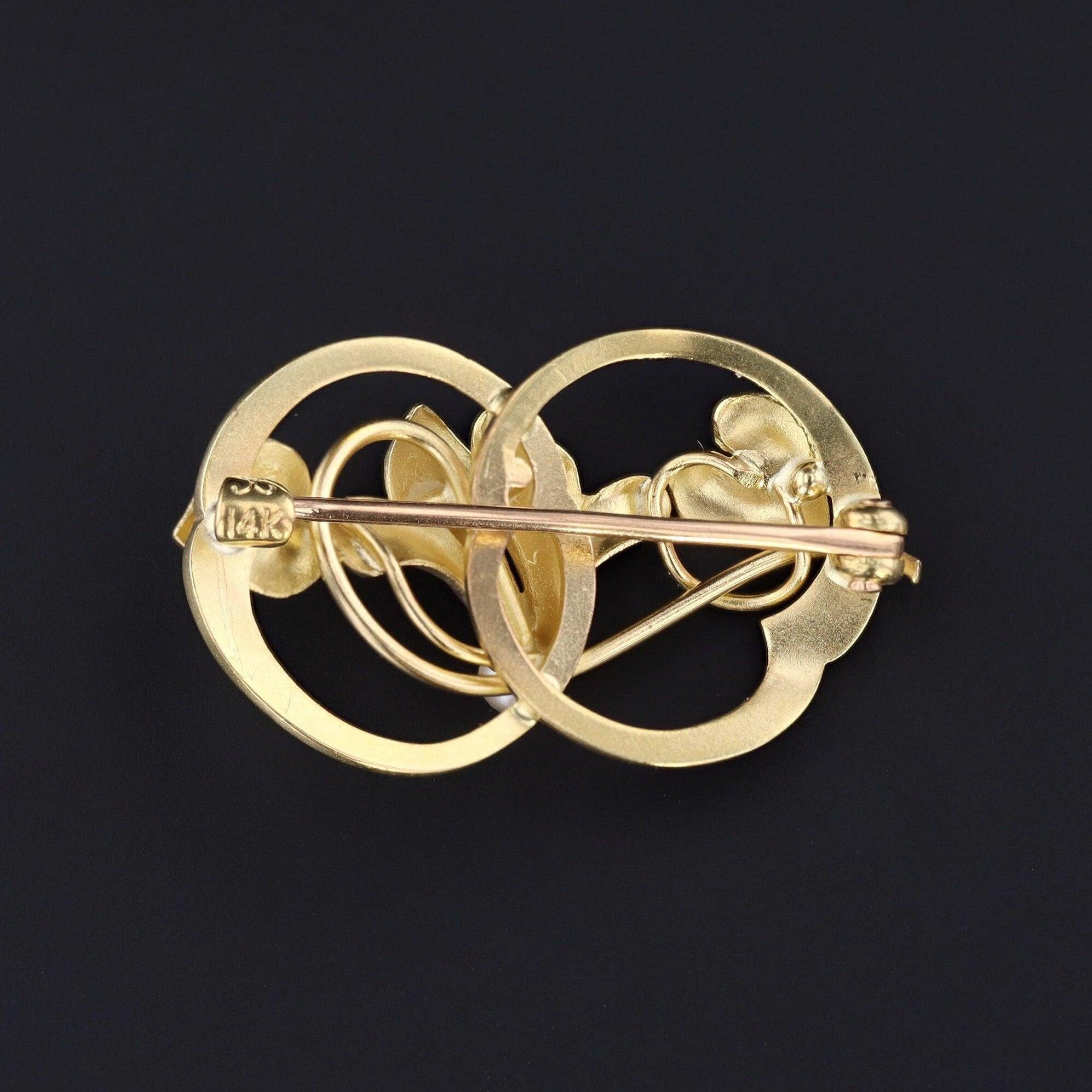 Cyclamen represent an empathetic, devoted heart, and they were often planted beside old monasteries and churchyards in the Mediterranean.

This antique 14k gold brooch (circa 1910) features a cyclamen adorned with iridescent enamel and a single