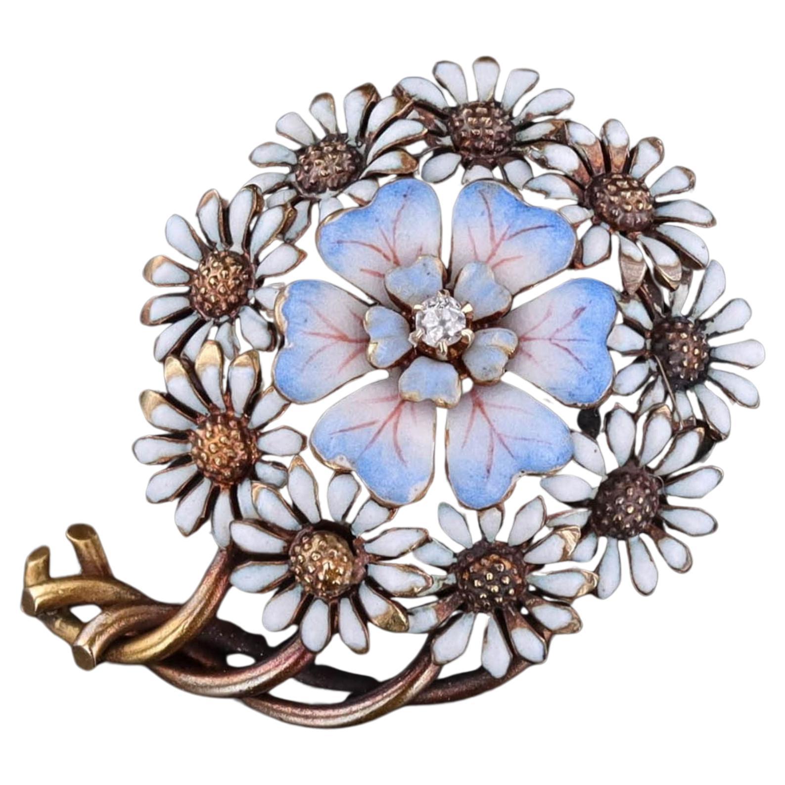 Broche fleur ancienne en or 14 carats et émail