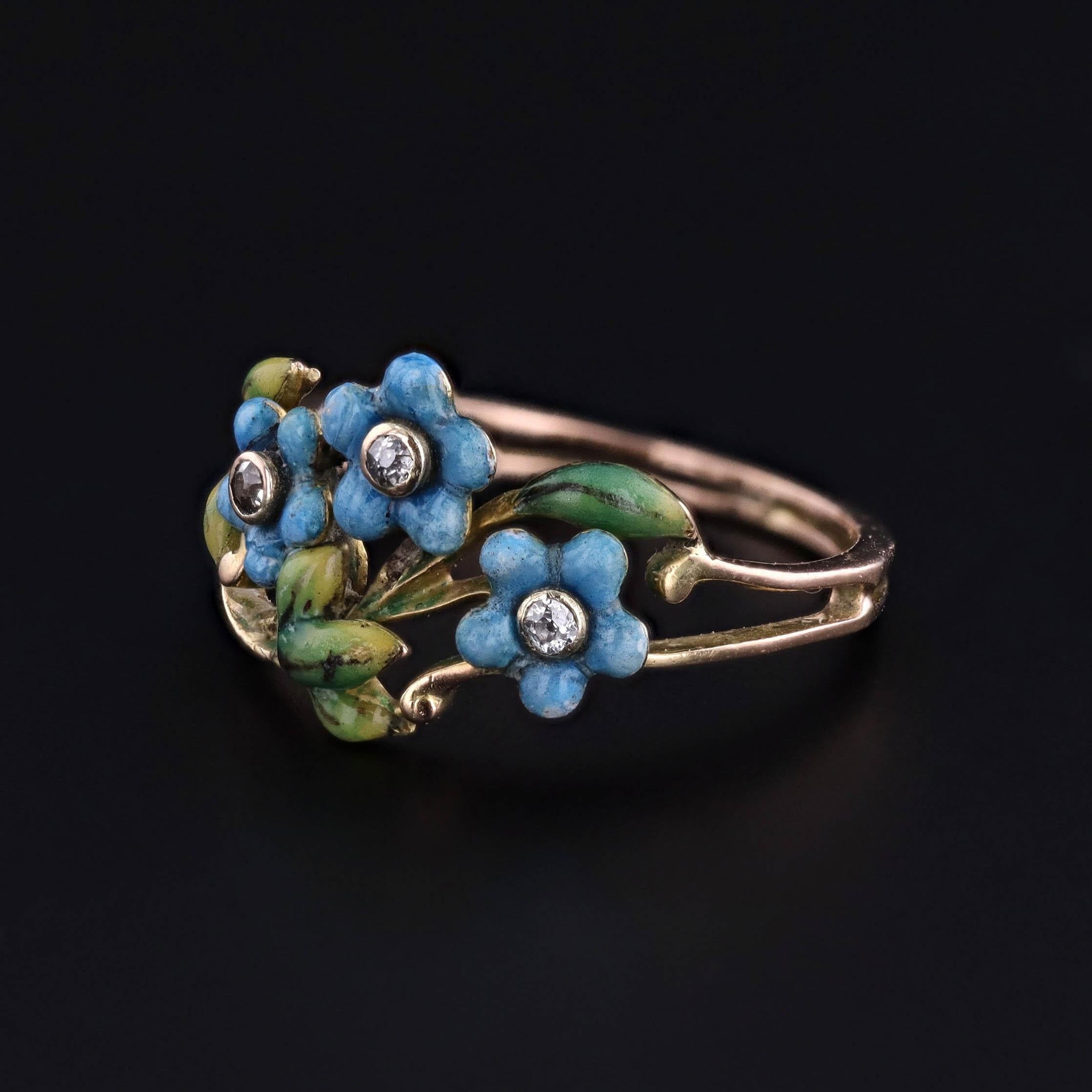 Edwardian Enamel and Diamond Forget-Me-Not Ring in 14k Gold, Circa 1910-1920

A refined treasure from the Edwardian era, this exquisite antique ring is a poetic celebration of sentiment and craftsmanship. Crafted between 1910-1920, it features