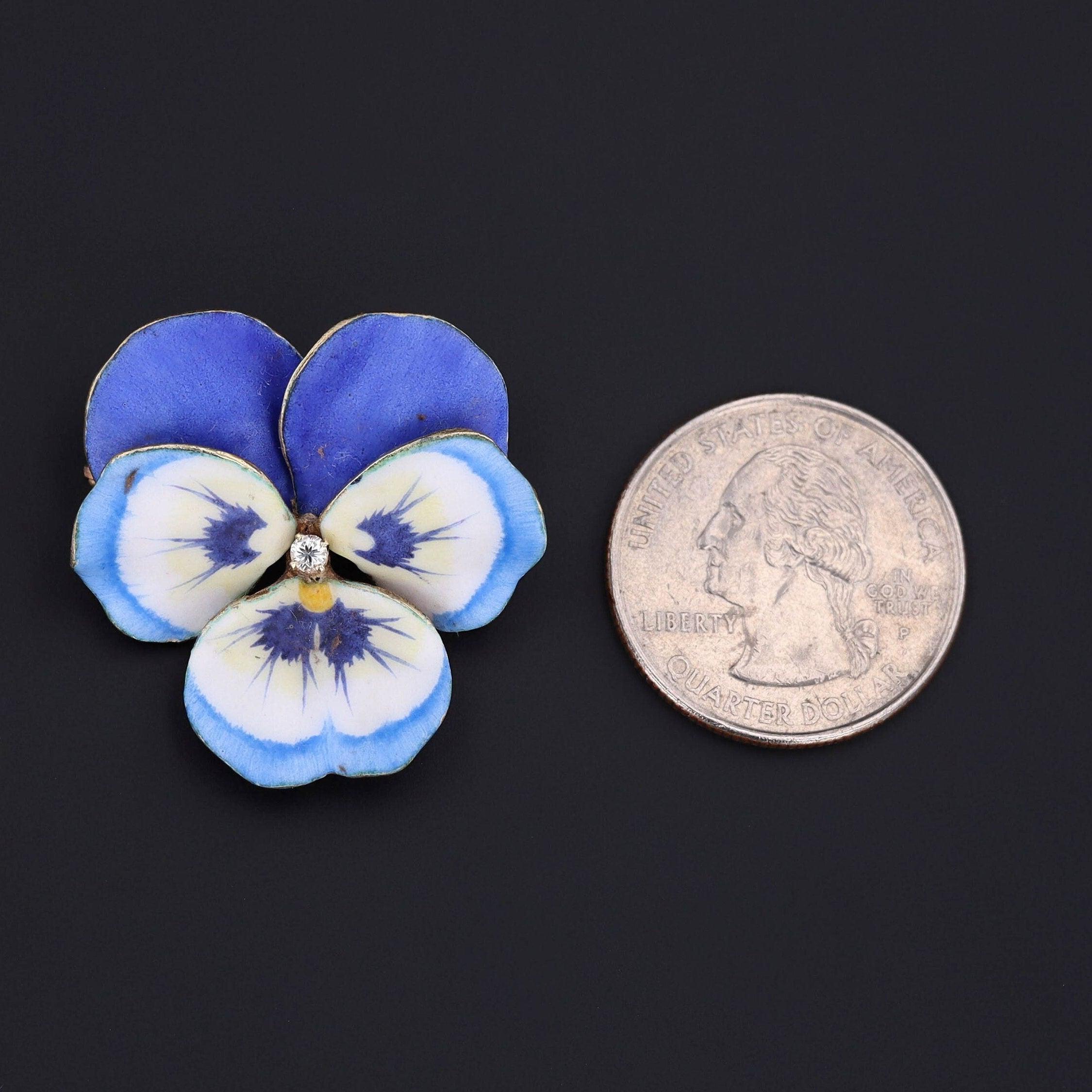 Pansies symbolize a hope that love should not be forgotten.

This realistically rendered pansy brooch (circa 1910) features vibrant blue enamel with hand drawn veining and a glistening diamond accent at its center.

The pansy is 14k gold and