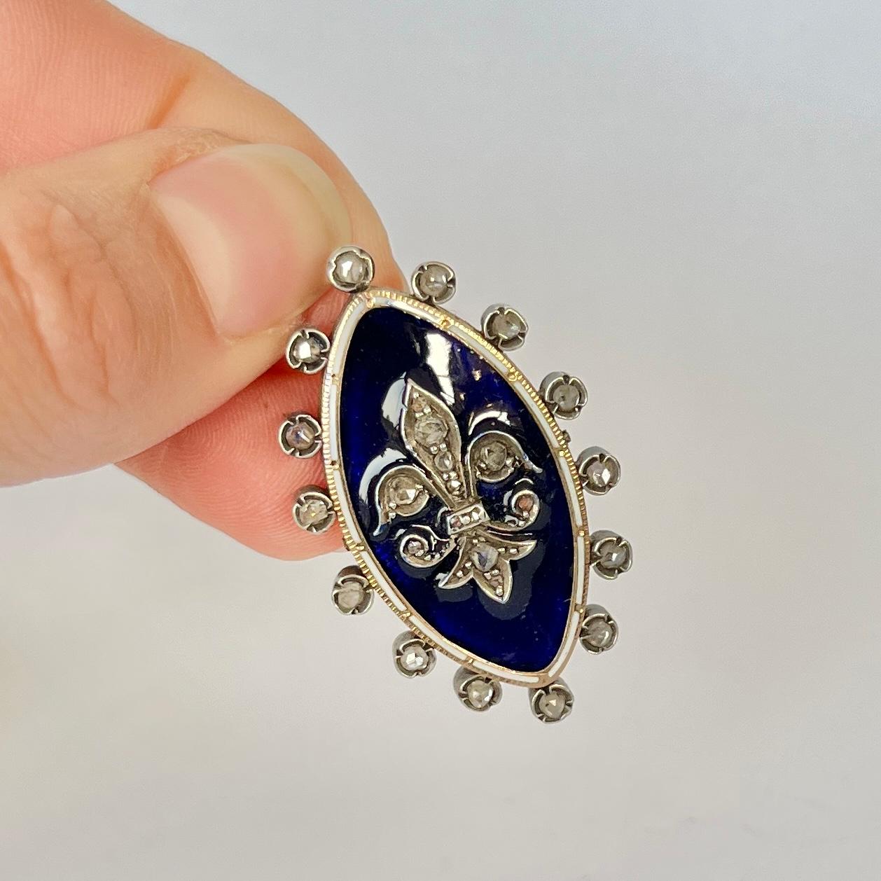 This lovely pendant has gorgeous blue enamel and is set with rose cut diamonds all the way around and at the centre. Modelled in 9ct gold. 

Dimensions: 37x23mm

Weight: 10.3g