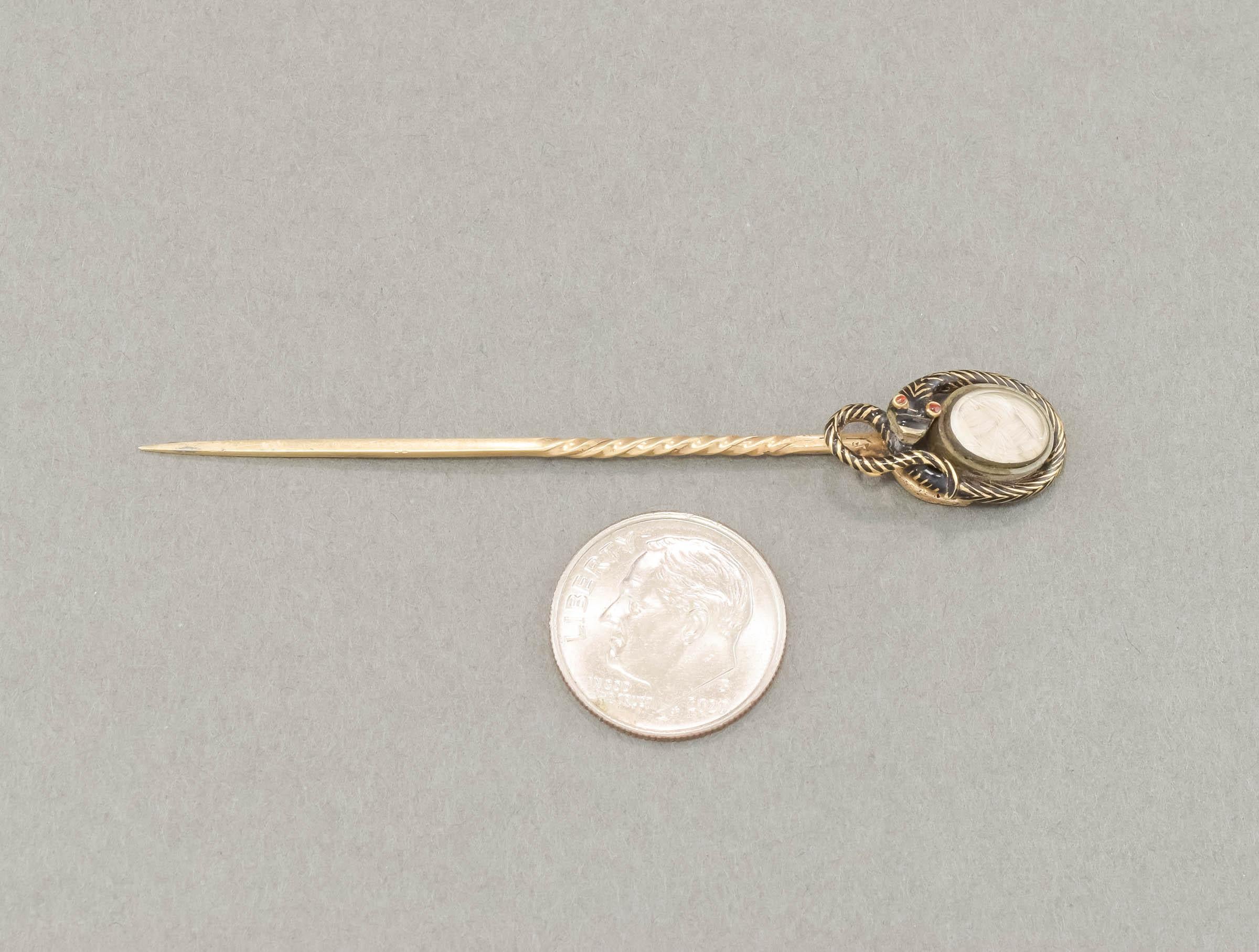 A stunning piece of antique early Victorian Mourning jewelry, this enameled Snake Stickpin is complete with its hair locket and original inscription on the reverse, with date of January 26, 1852.

Crafted of solid 18K gold (the snake) with gold