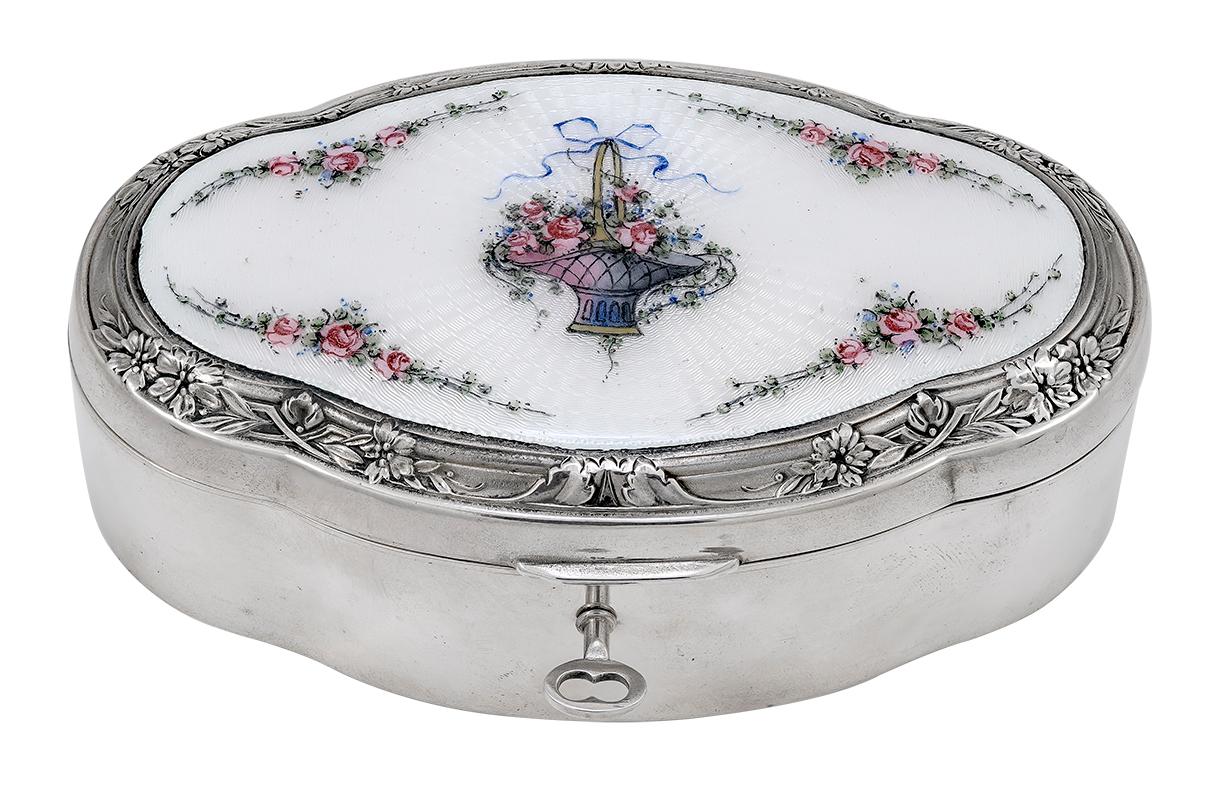 Beautiful antique jewelry box:  On the top is a lovely guilloche enamel multi-colored basket of flowers, on a brilliant white background,  surrounded by branches of roses.  Set in a heavy gauge sterling silver scalloped box.  5 1/2