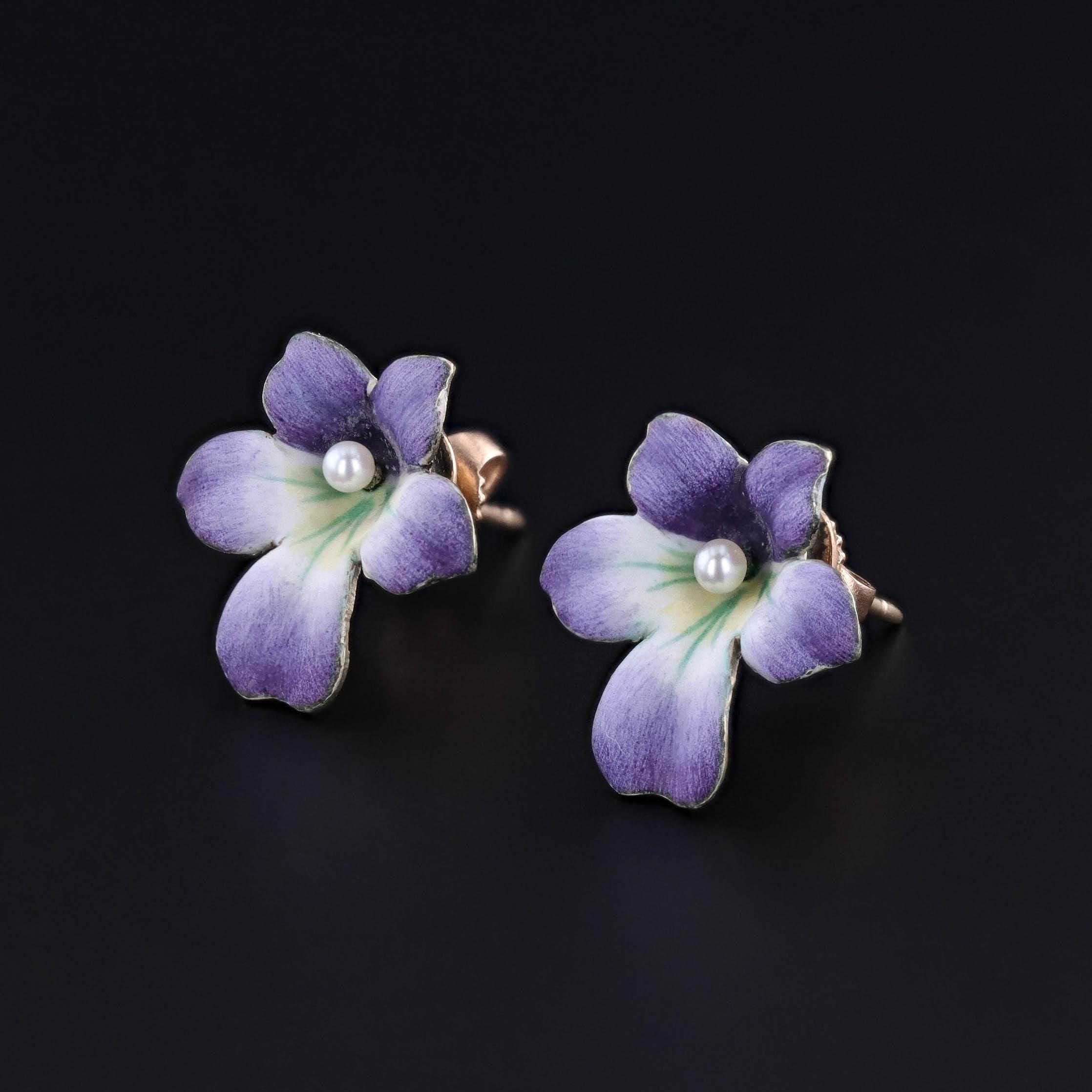Antique Violet Earrings: These earrings feature 14k gold violets with purple and white enamel, and pearl accents at their centers. They were originally part of an antique pin (circa 1910-1920) that our jeweler transformed by adding 14k gold posts