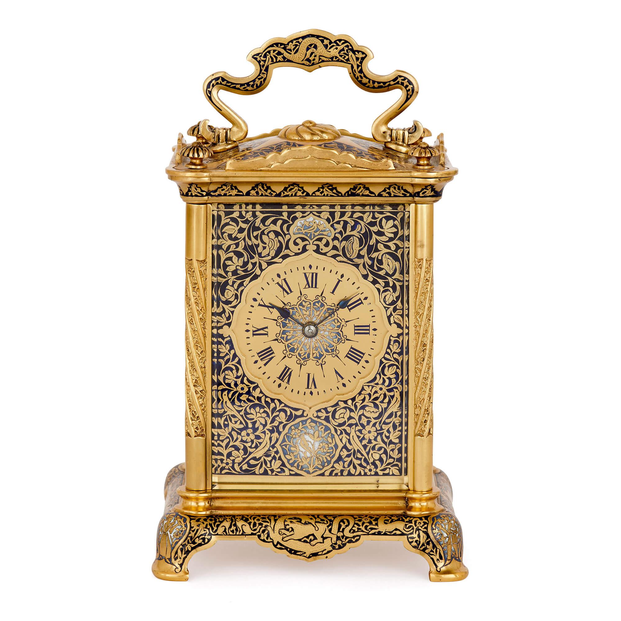 The contrast between rich blue enamel, in light and dark hues, and bright gilt bronze gives this carriage clock a sumptuous, luxurious feel. With a timeless design, the clock could be used within a traditional or modern design scheme. Equally it
