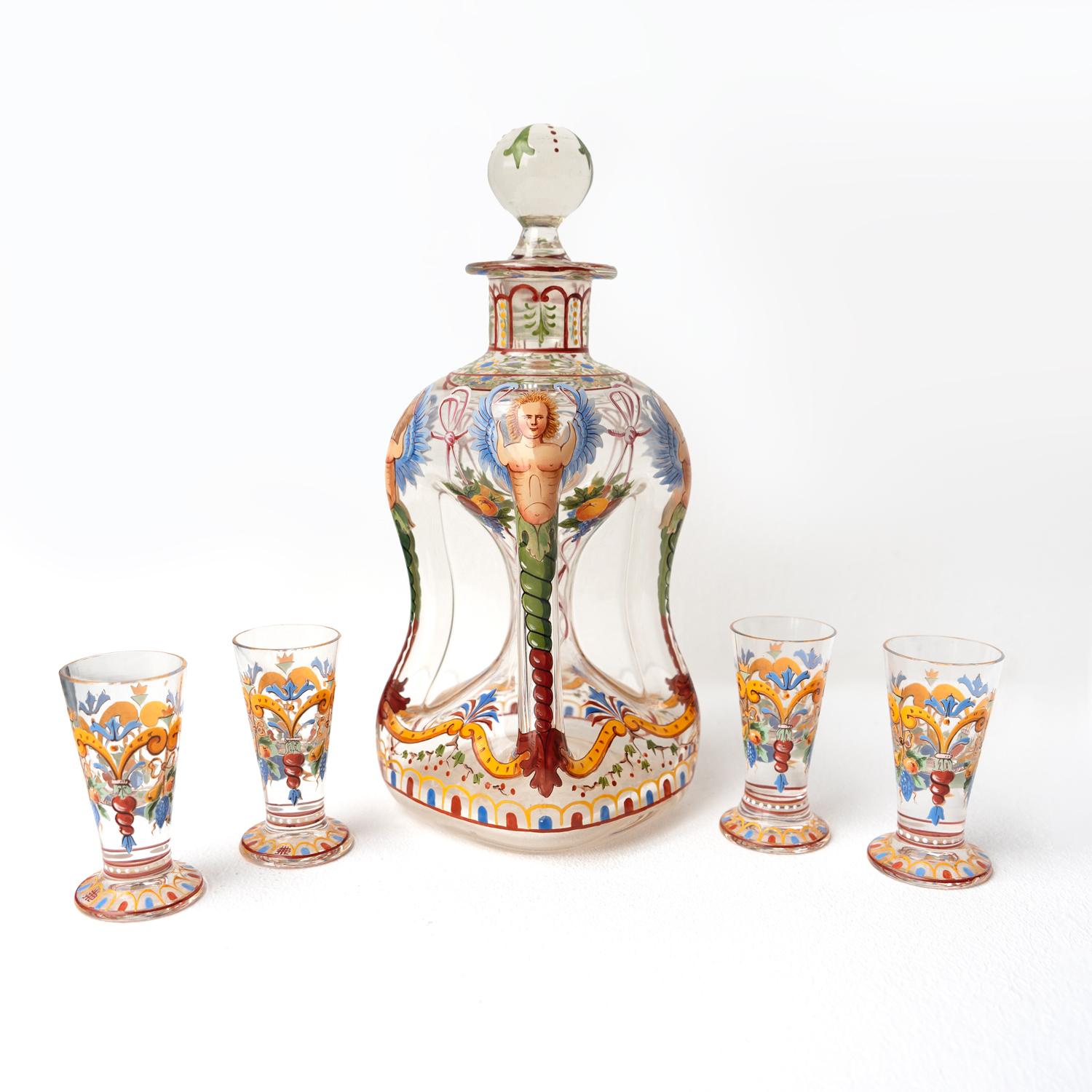 ANTIQUE AUSTRIAN DECANTER AND CORDIAL GLASSES

Hand-blown pinched clear glass decanter and four matching cordial glasses.

Profusely decorated by hand with different colour enamels depicting winged Venetian grotesques and polychrome decorative