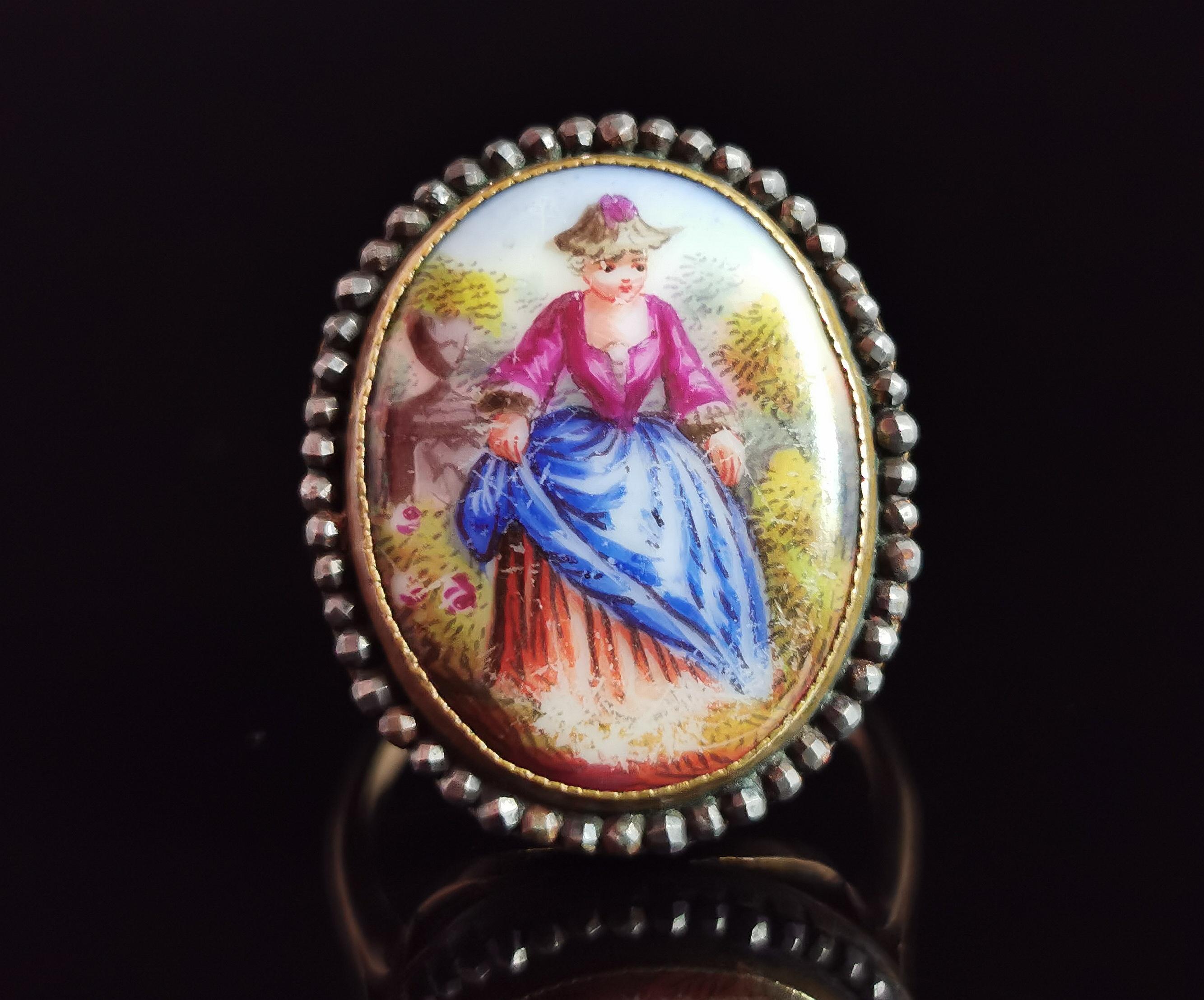 A superb antique 19th century portrait miniature ring.

A tiny portrait, all hand enamelled in vibrant colours of a lady in full profile in a garden setting, the portrait has been enamelled on mother of pearl and this can be seen through the back of