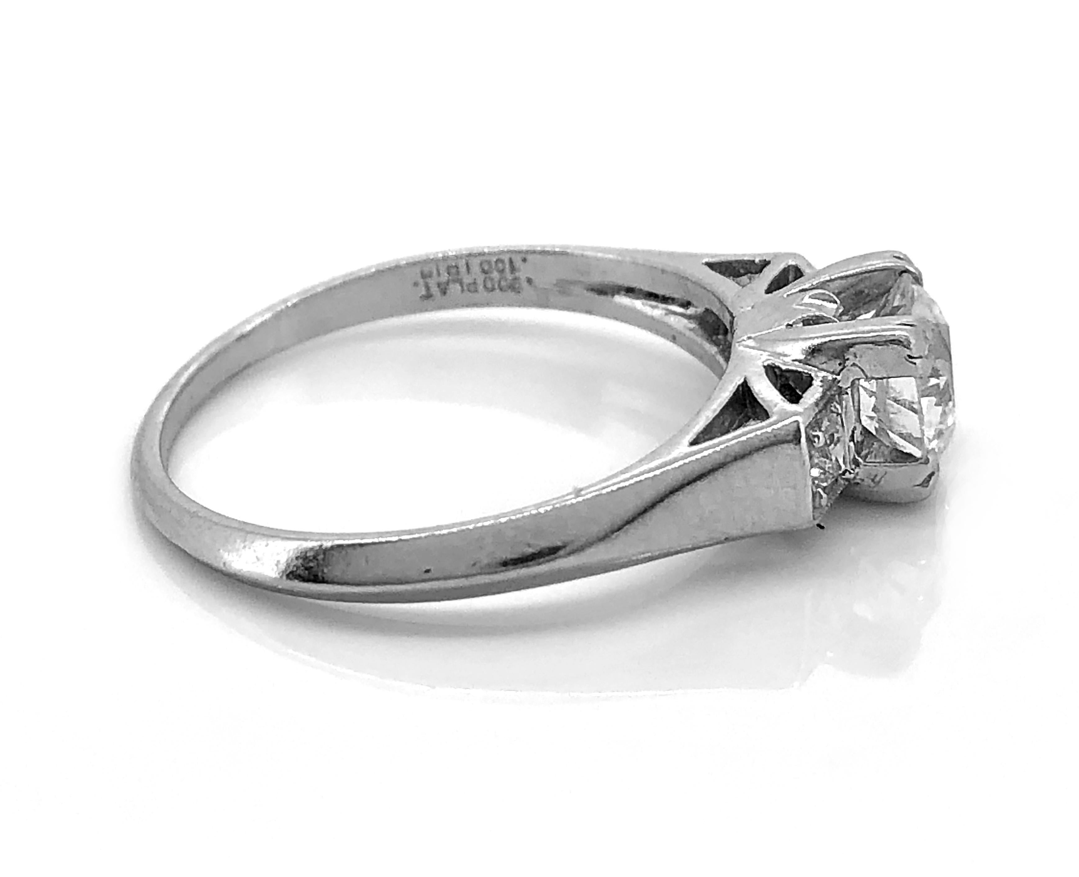 An Art Deco platinum & diamond antique engagement ring featuring a .75ct. apx. diamond with fish tail prongs and accenting diamonds weighing .15ct. apx. T.W. The antique engagement ring is very geometric in design. It has a very bold look!

Primary