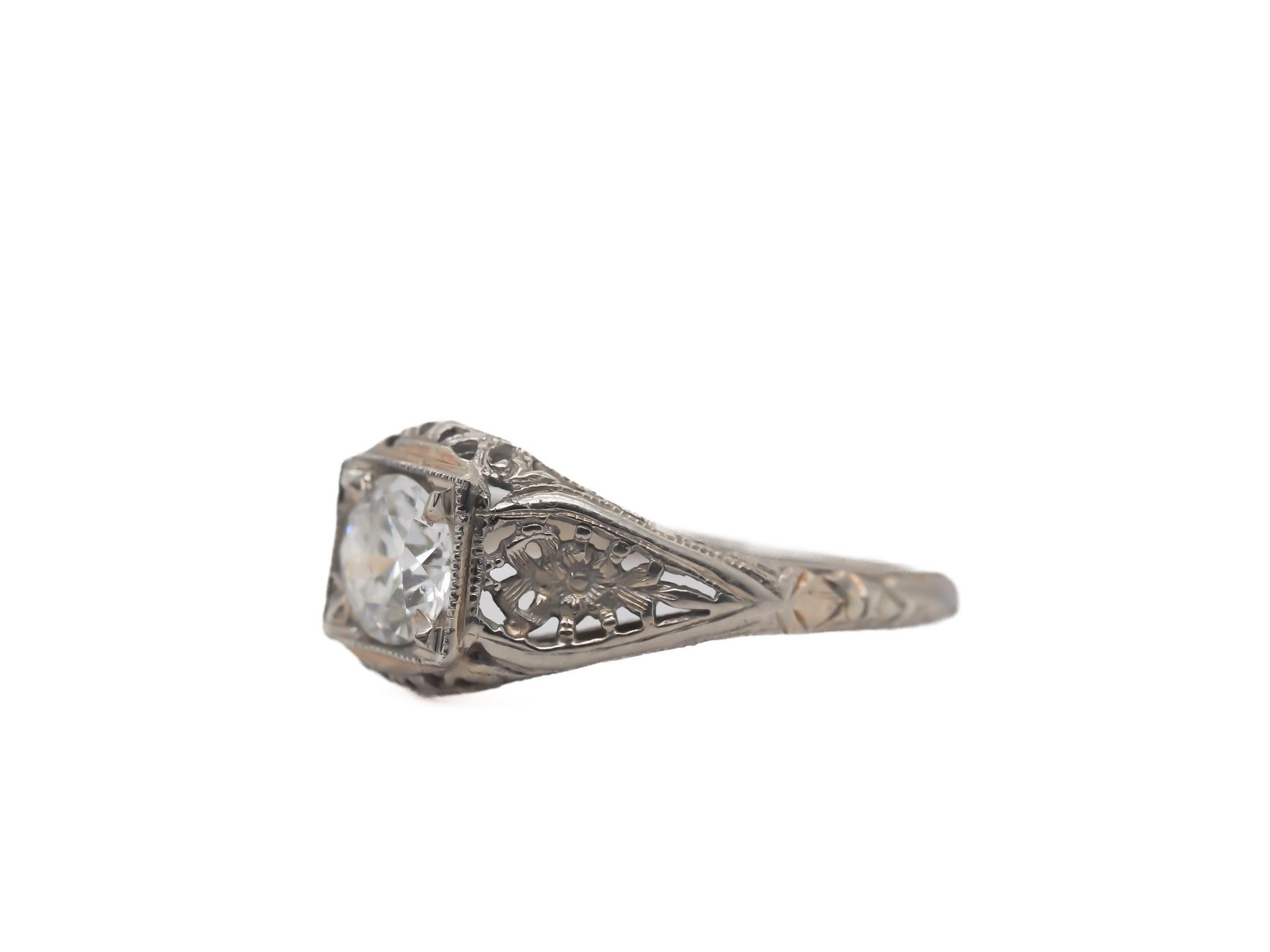 Item Details:
Ring Size: 7
Metal Type: 18K White Gold
Weight: 1.5 grams

Center Diamond Details
Carat Weight: .15ct
Measurements : 3.0mm
Color: H
Clarity: VS2

Finger To Top Of Stone Measurement: 5.47mm