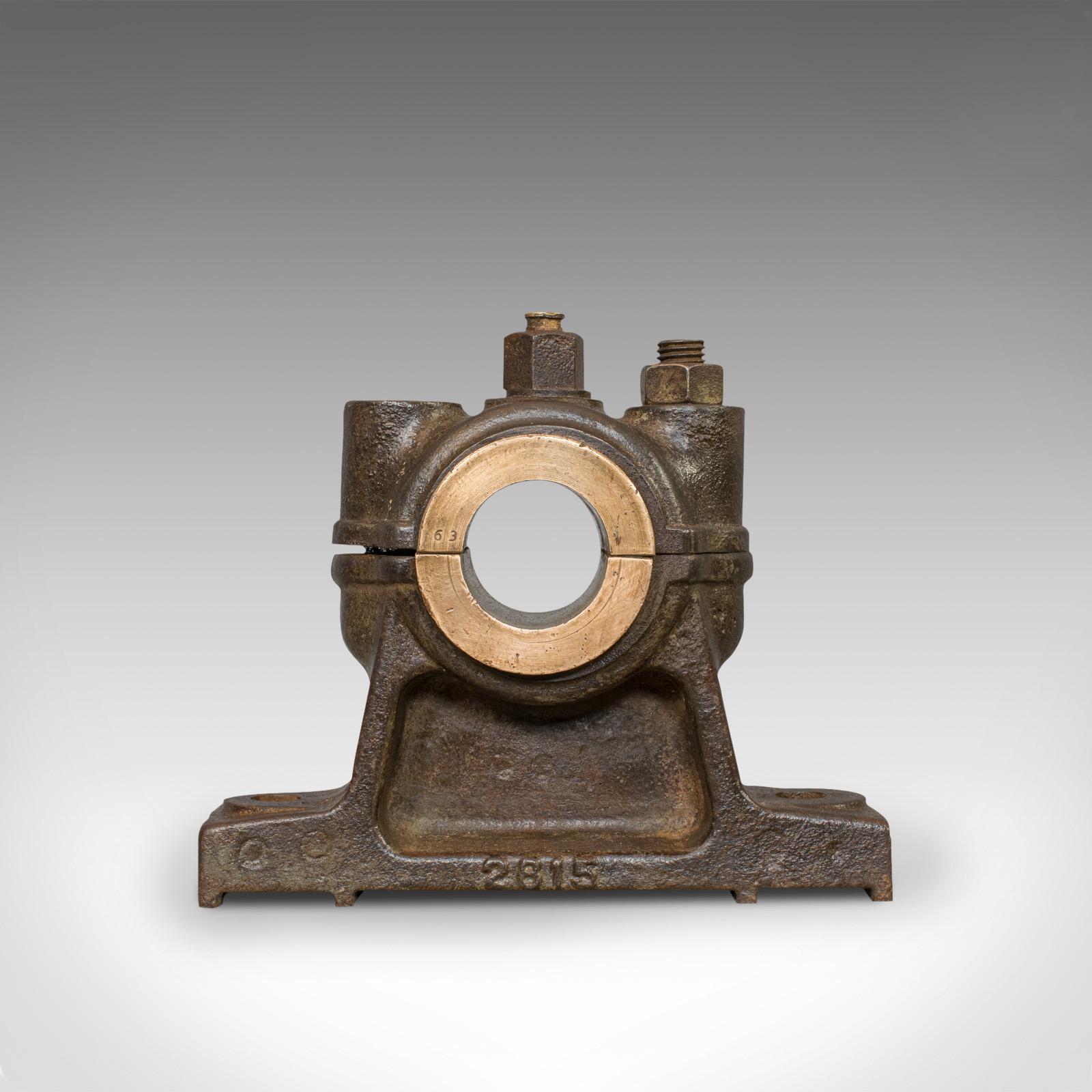 This is an antique engine bearing with waxed finish. An English, cast iron and bronze desktop paperweight or ornament, and dating to the late 19th century, circa 1900.

Finely aged form and a fascinating desk ornament
Displaying a desirable aged