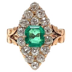 Antique English 15 Carat Gold Old Mine Cut Diamond and Emerald Navette Ring