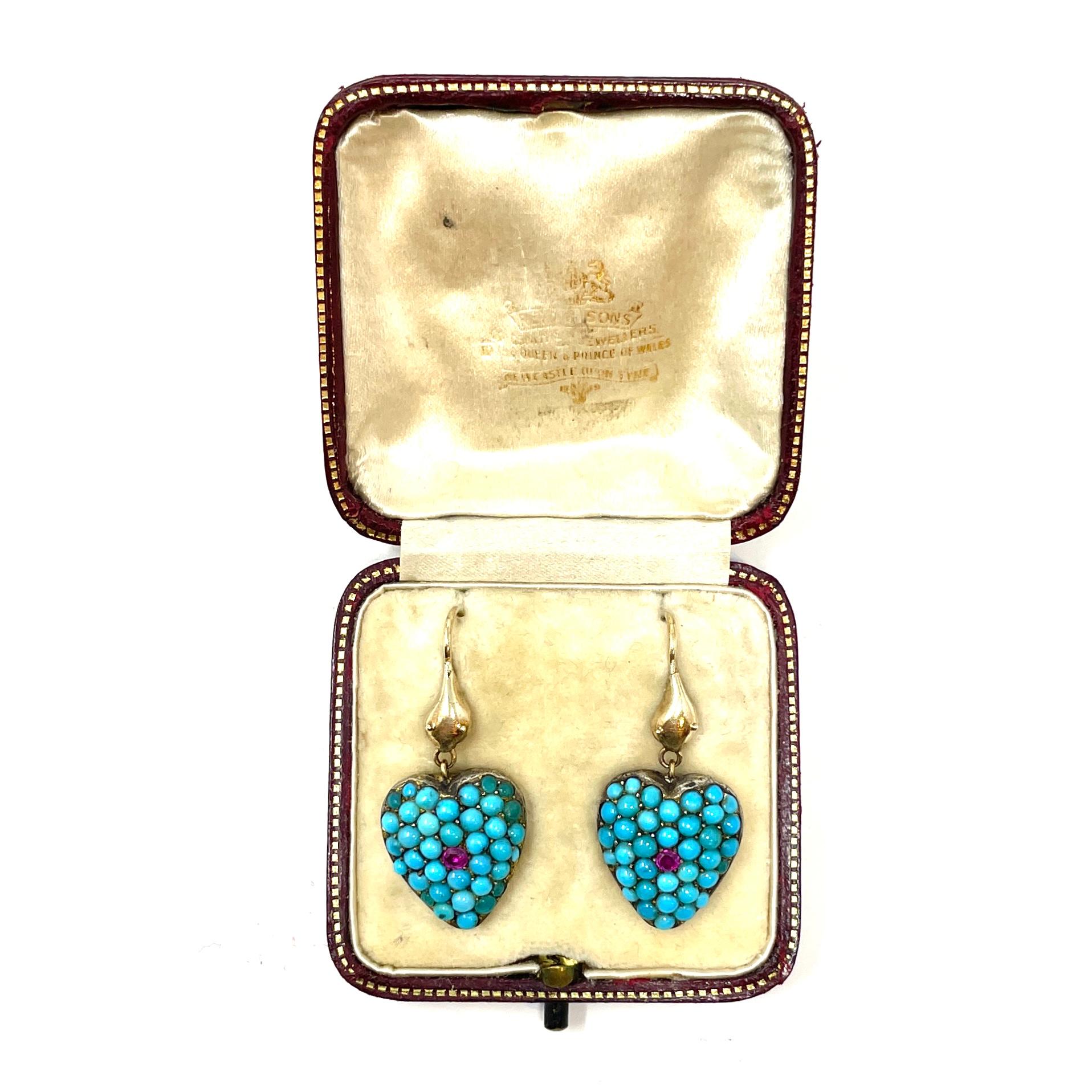A wonderful pair of 19th century Persian turquoise earrings with a snake and heart motif in their original box from a jeweller in Newcastle Upon Tyne. The Snake motif was extremely popular in the Victorian Era, and this pair of earrings combines the