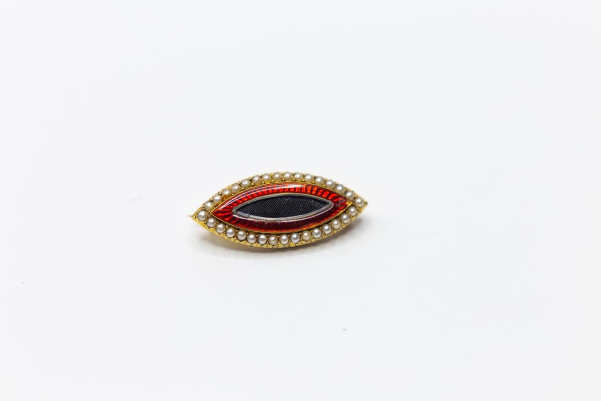 Antique English 15k gold red enamel and seed pearl navette shaped brooch. 1830’s. It weighs 7.50 grams.
