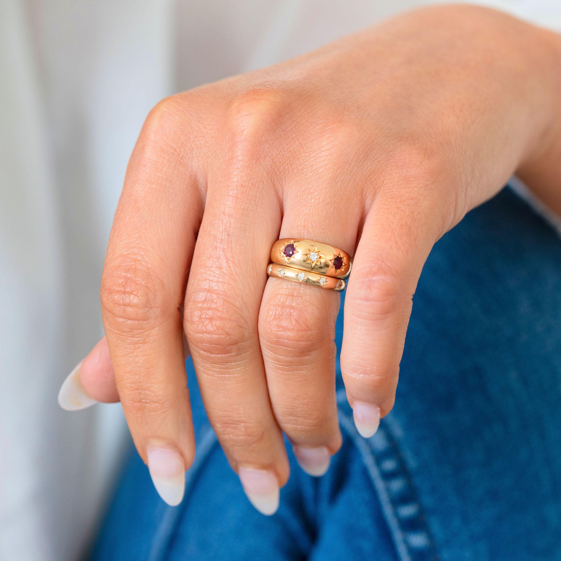 Step into the elegance of a bygone era with this exquisite Antique Edwardian ring, dating back to 1904. Meticulously crafted from 18ct gold, this stunning piece embodies the refined sophistication of the Edwardian period.

At its heart, the ring