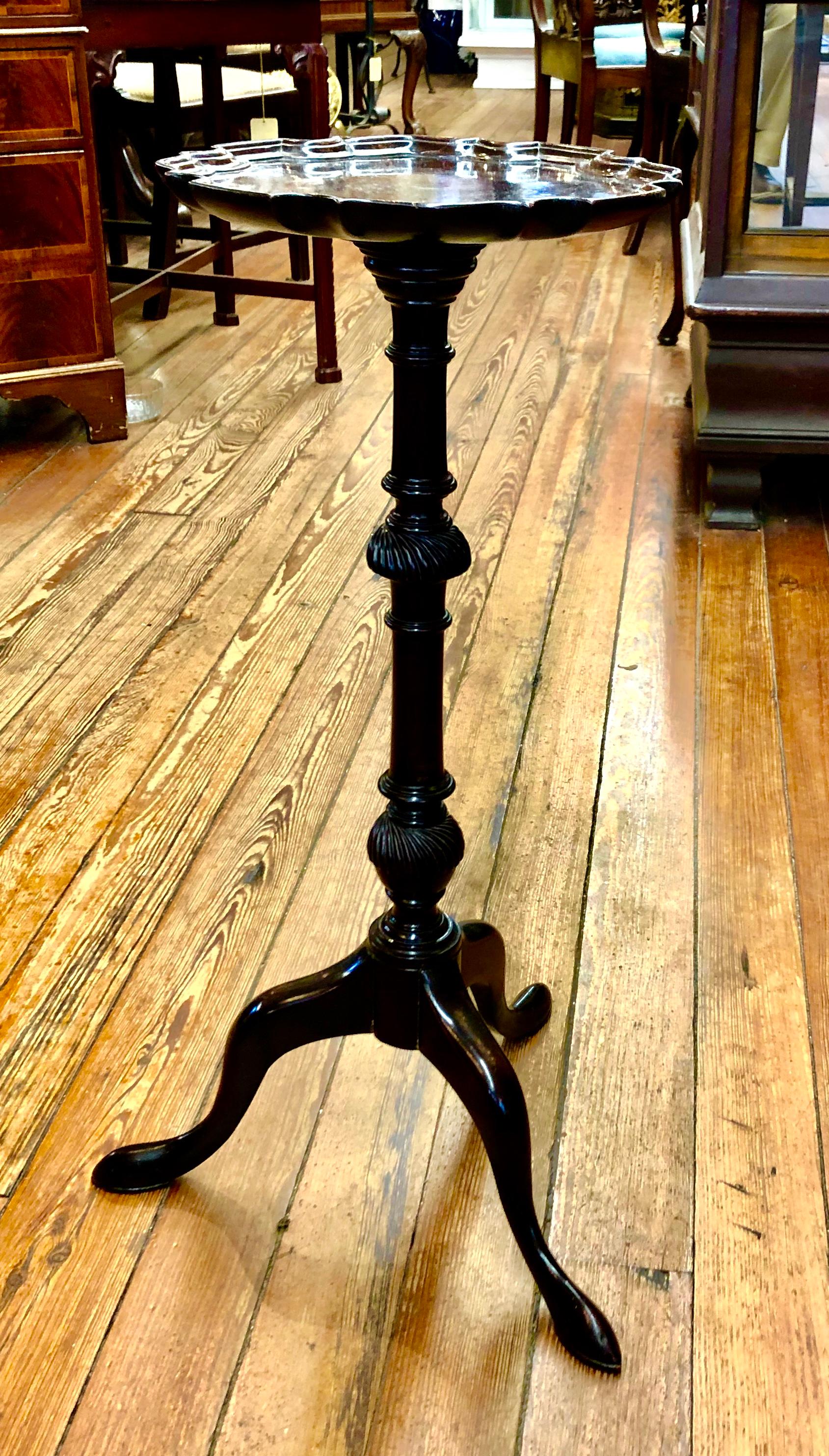 A wonderful late 19th century hand carved solid mahogany Geo. III style kettle stand, candle stand or wine table with superbly carved piecrust edge (not applied - carved out of the solid, one piece top); upon a turned, spiral carved pedestal