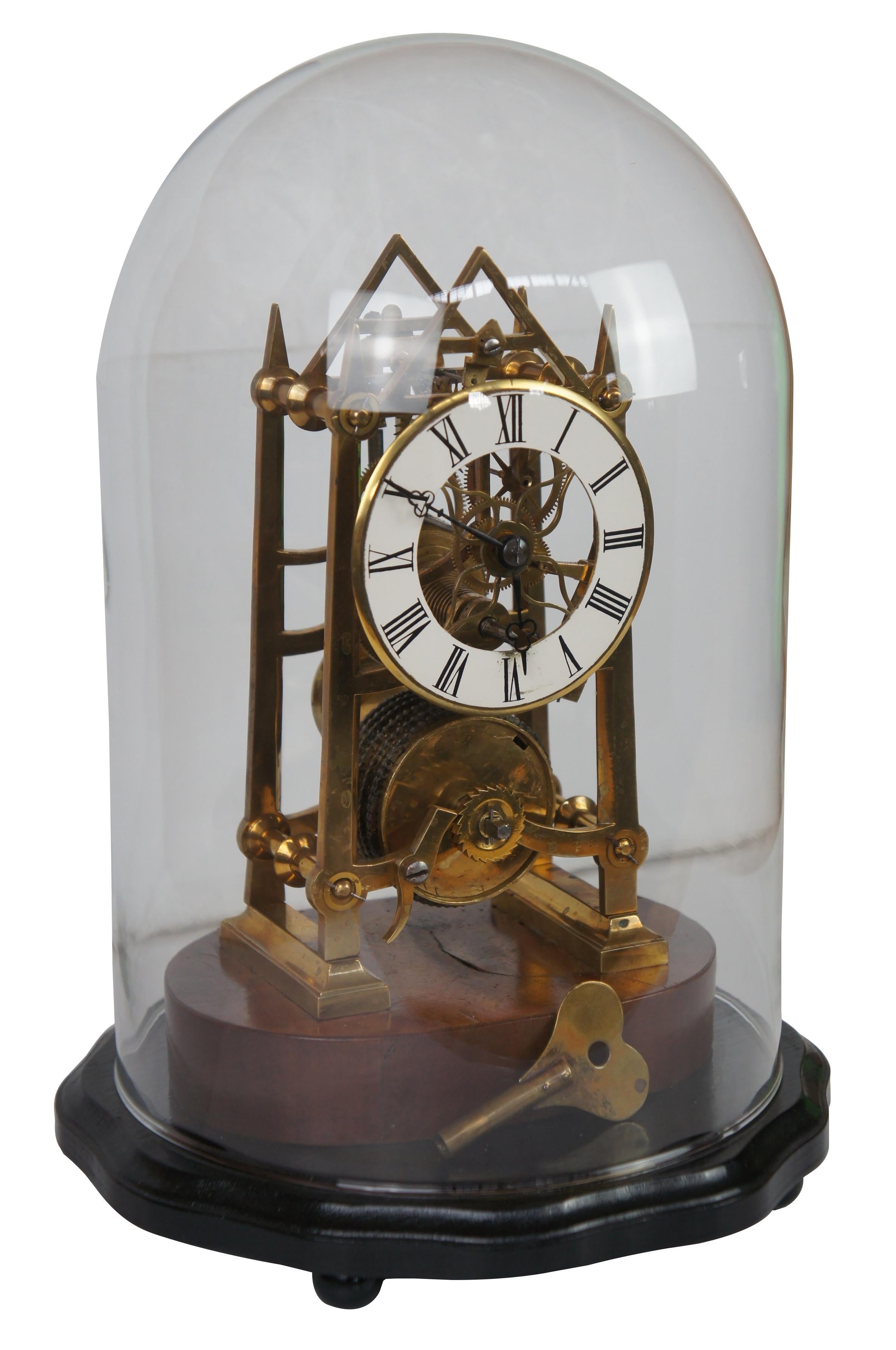 Antique mid 19th century 8 day skeleton clock. Centrally mounted on wood base featuring exposed Fusee movement and protected from dust by a glass dome.
 