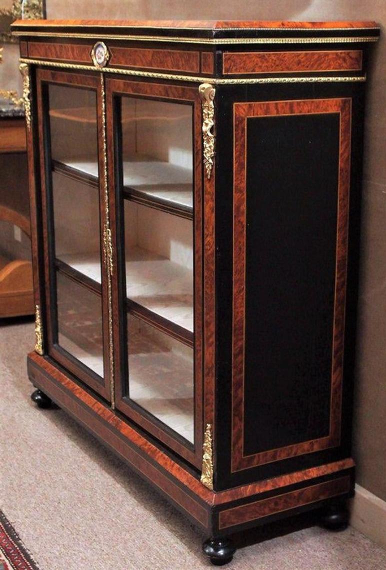 This handsome cabinet reflects the elegance of its time. It is a lovely piece of cabinetry. 
 