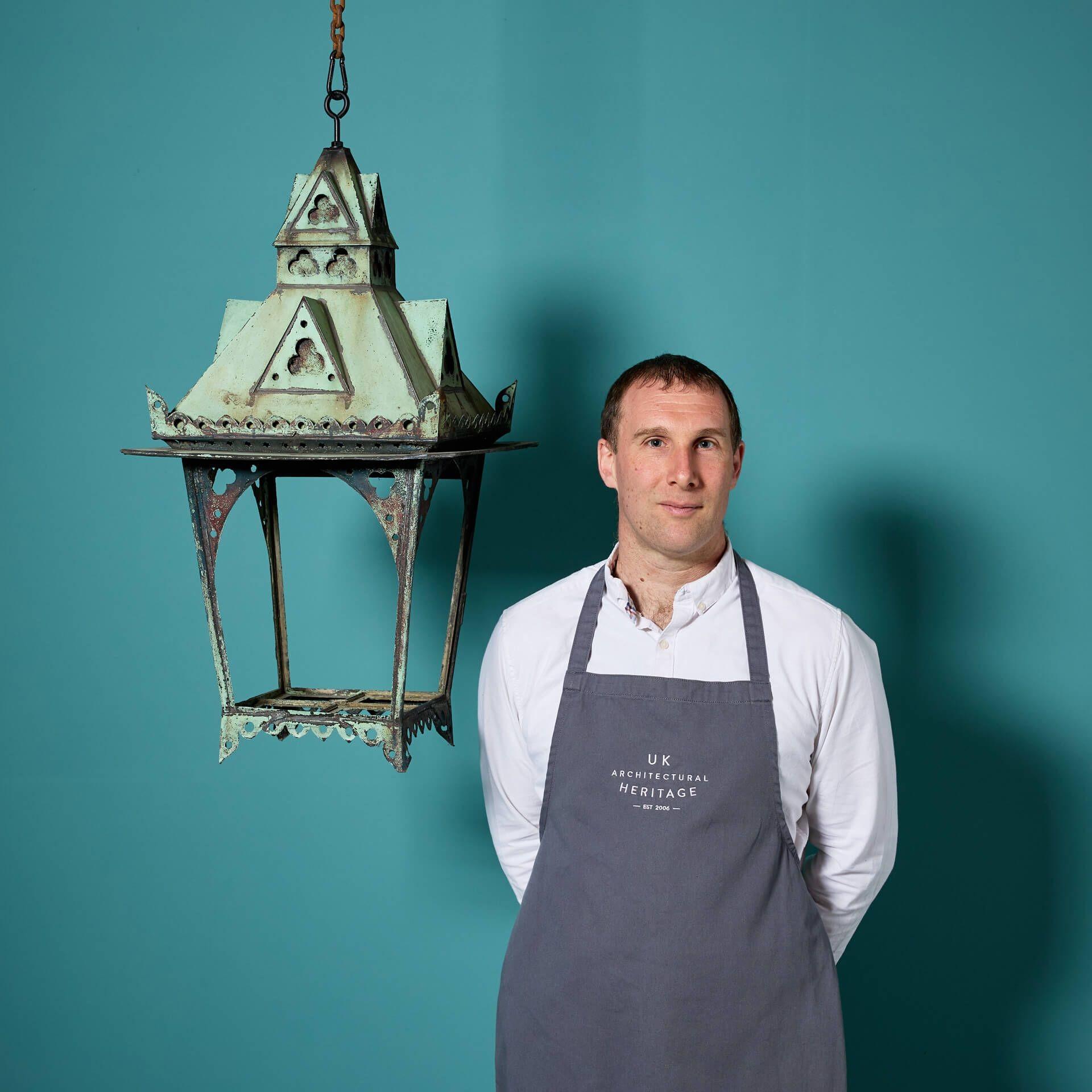 An antique English copper wall hanging lantern dating to the late 19th century, suitable for indoor or outdoor use.

This lantern is beautifully styled incorporates an array of styles, complimented by its weathered copper creating an unusual