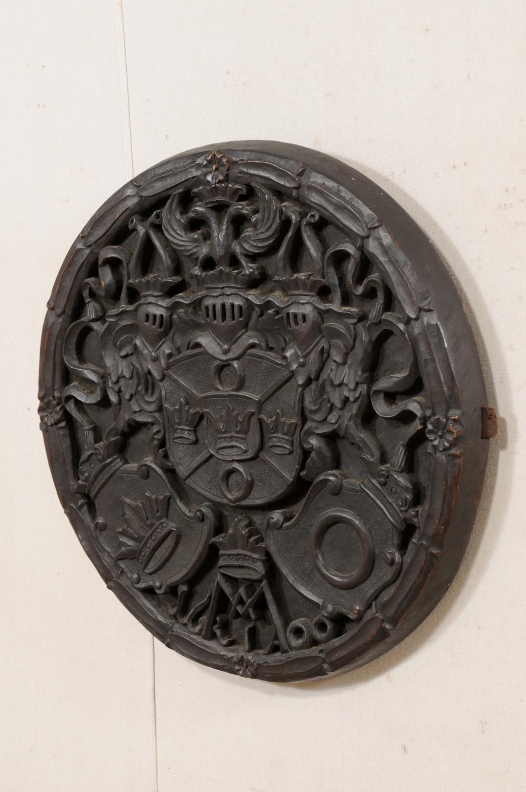 19th Century Antique English Round Wall Plaque Carved in Knights, Shield & Crown Motif  For Sale
