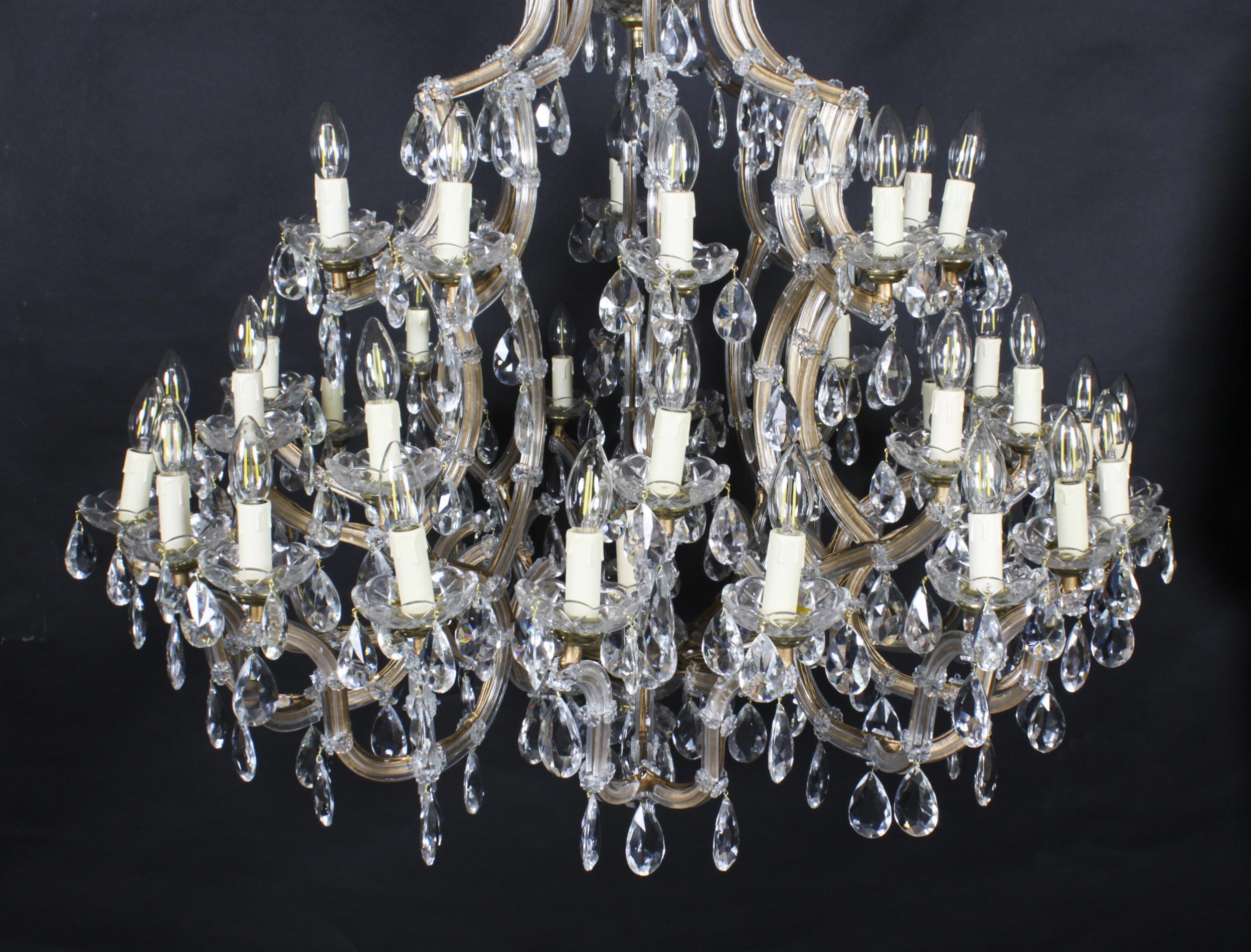 This is a beautiful English Ballroom crystal chandelier with forty-one lights arranged over in three tiers, circa 1920 in date.
 
This magnificent chandelier has exceptional crystal covered casting with an abundance of exquisite large crystal