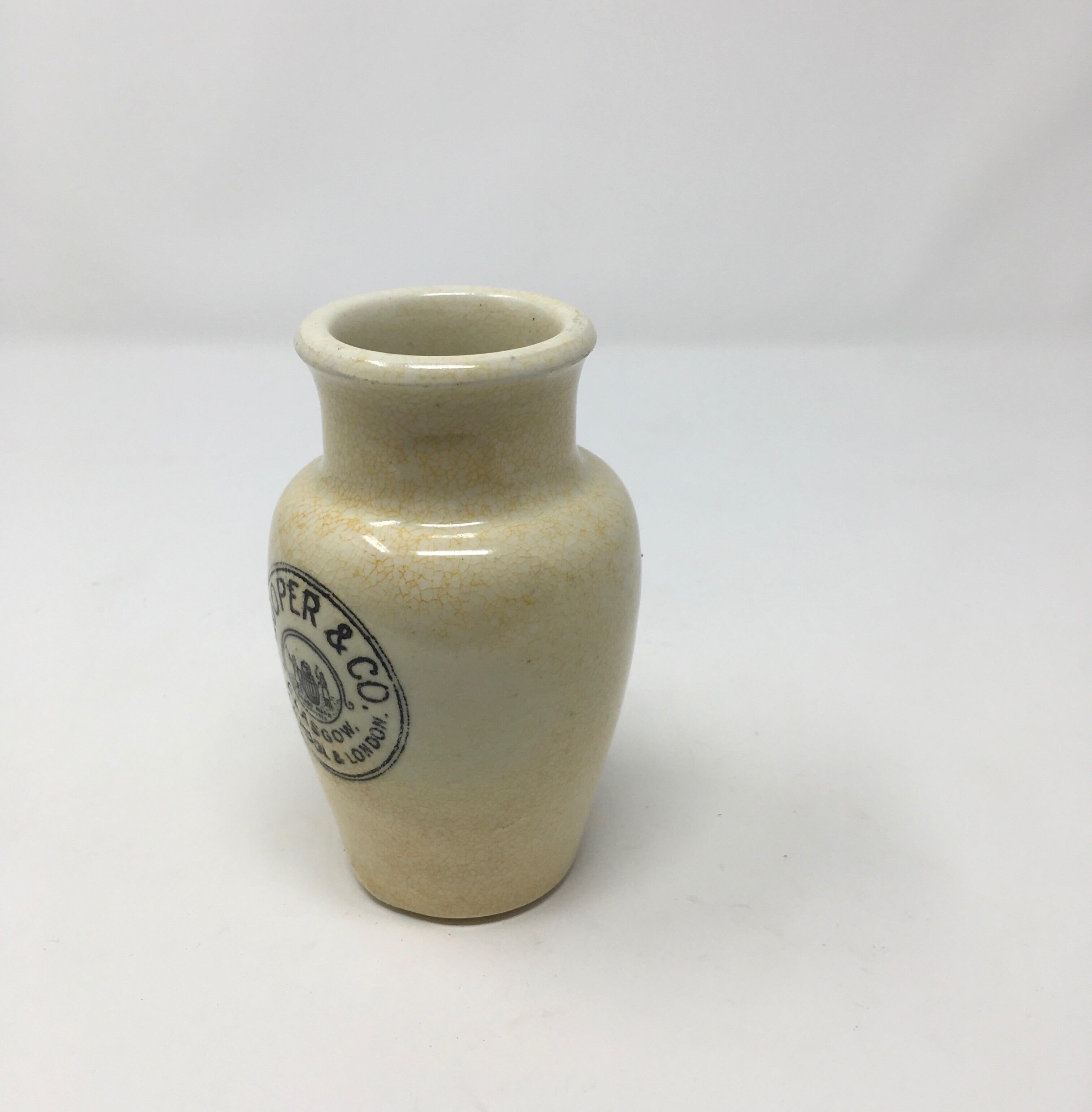 This is a listing for an antique English advertising pot with black transfer decoration reading Cooper & Co Cream, Glasgow, Liverpool. & London. The stoneware pot was once used to sell cream. This pot can be used now to serve milk or cream or as a