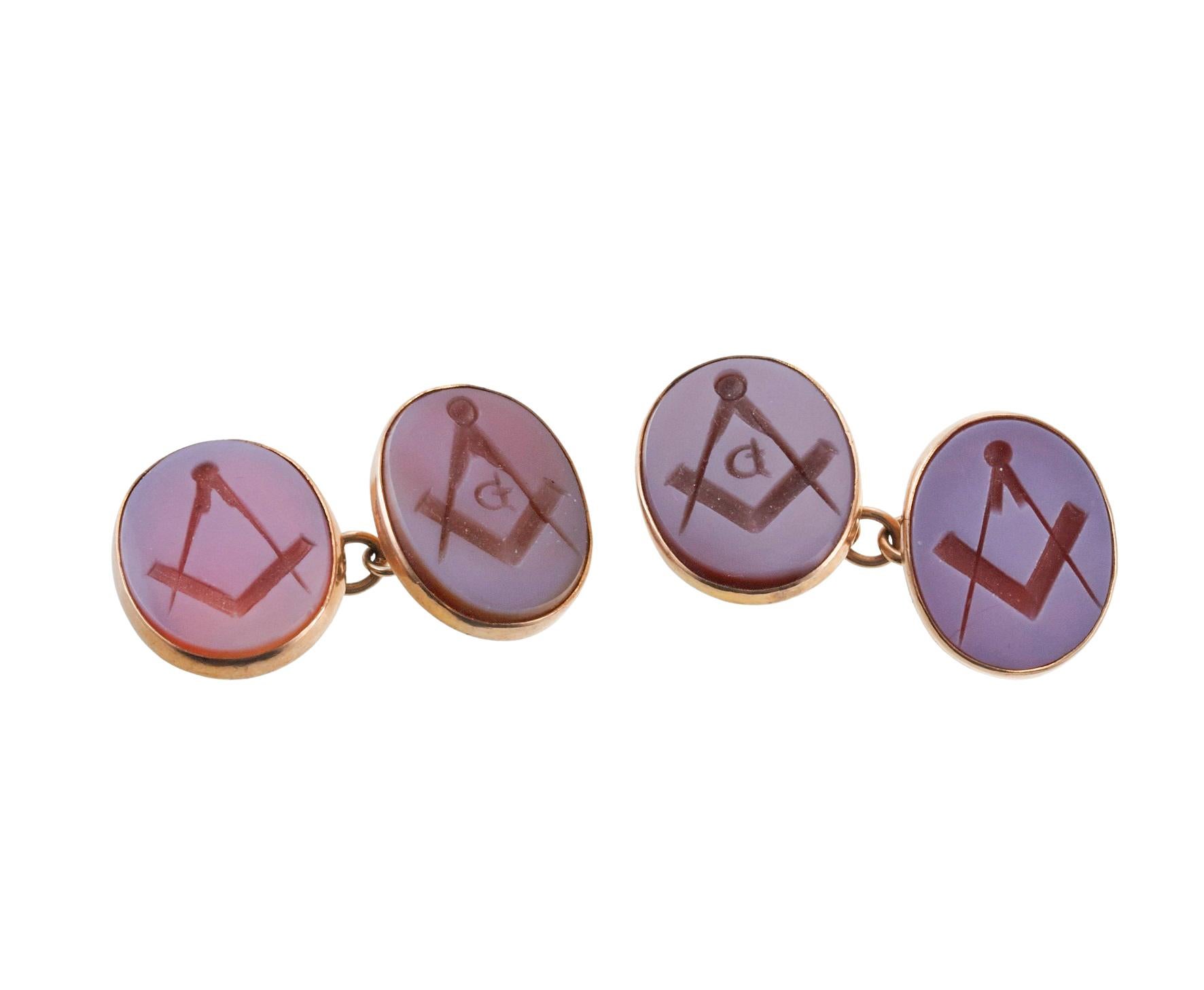 Antique English made pair of 9k gold cufflinks, depicting Masonic logo, in agate intaglio. Each oval top measures 19mm x 15mm. Comes in original box. Marked 9ct, 901. Weight - 9.7 grams. 