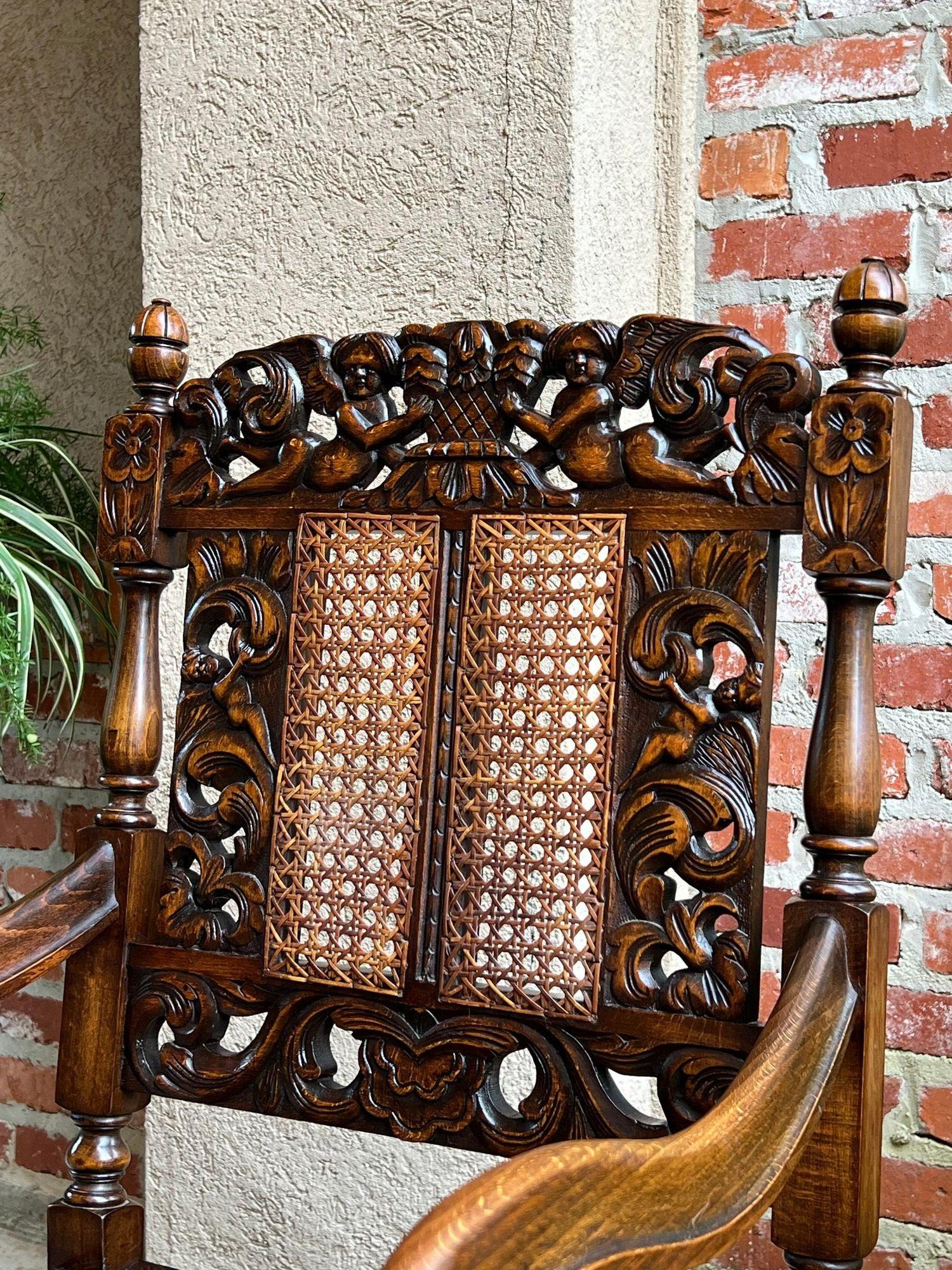 Antique English Arm Chair Carved Oak Cane Seat Renaissance Cherubs Fireside For Sale 9