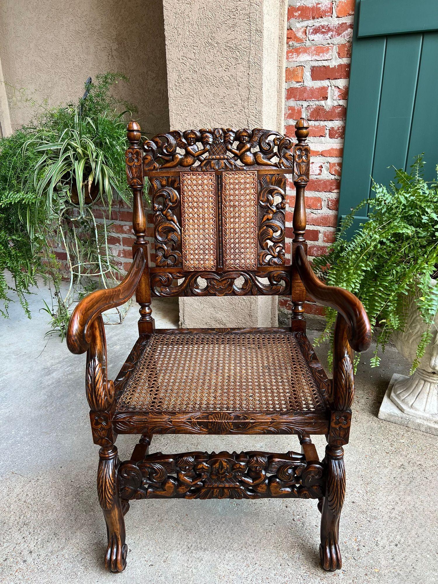 Antique English Arm Chair Carved Oak Cane Seat Renaissance Cherubs Fireside.

Direct from England, a gorgeous antique British arm chair with stunning carved features. The high back features oak panels with open or “pierced” carved Renaissance