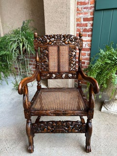 Antique English Arm Chair Carved Oak Cane Seat Renaissance Cherubs Fireside