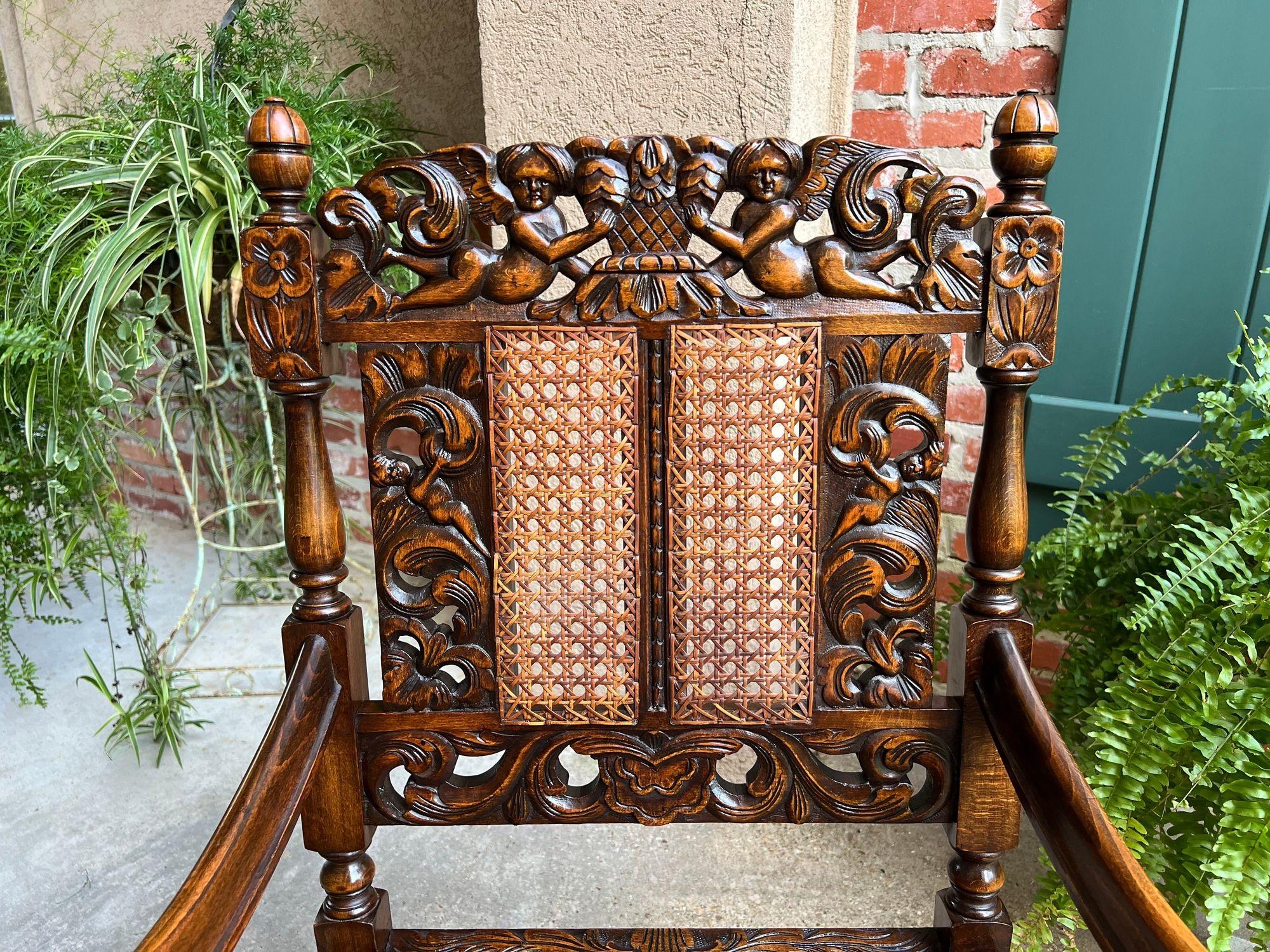 Early 20th Century Antique English Arm Chair Carved Oak Cane Seat Renaissance Cherubs Fireside For Sale