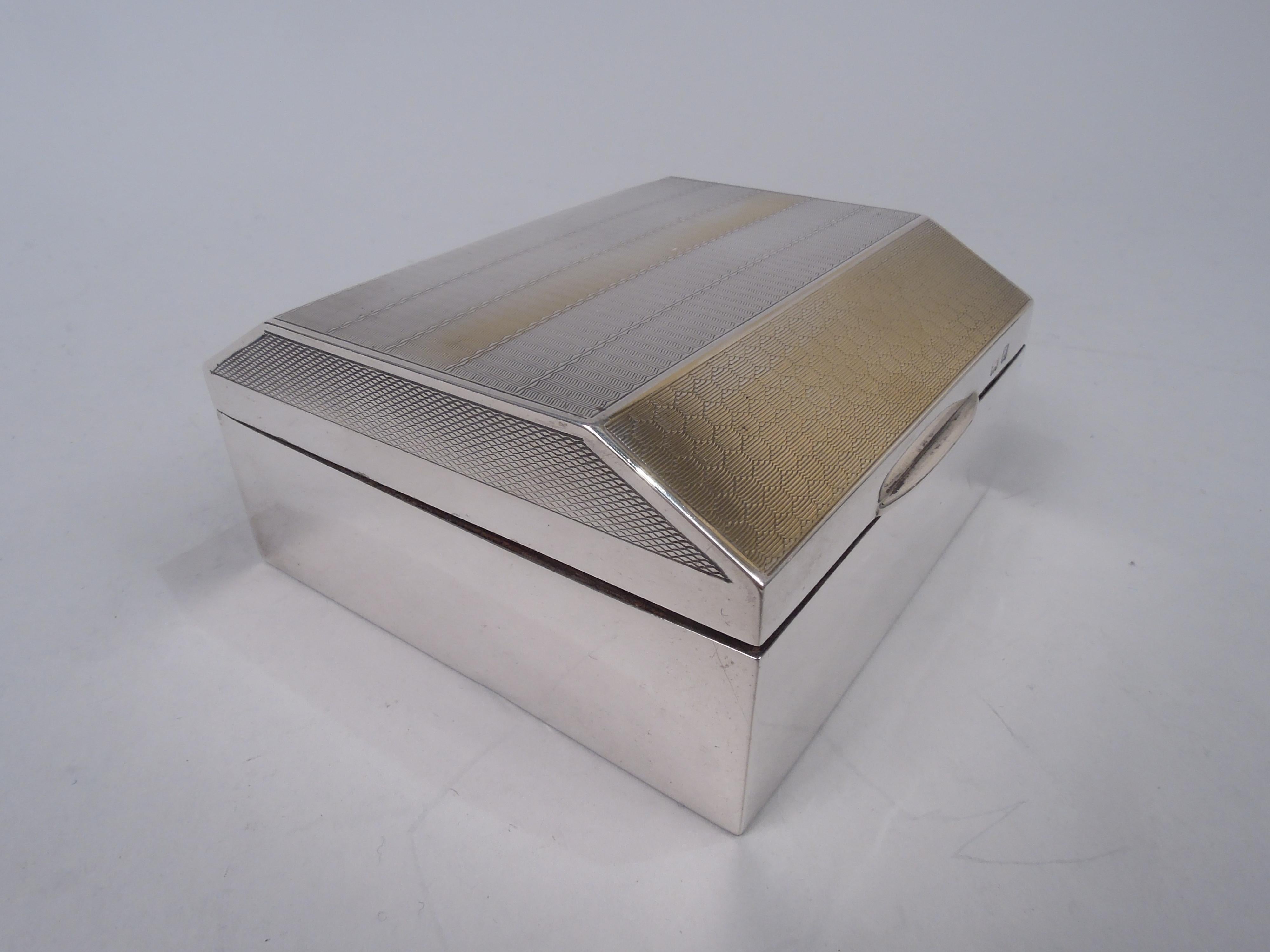 Art Deco sterling silver box. Made by Henry Matthews in Birmingham in 1927. Square with straight and plain sides. Cover hinged, tabbed, and chamfered. On top parcel gilt with engine-turned ornament with wavy lines between honeycomb; sizes have