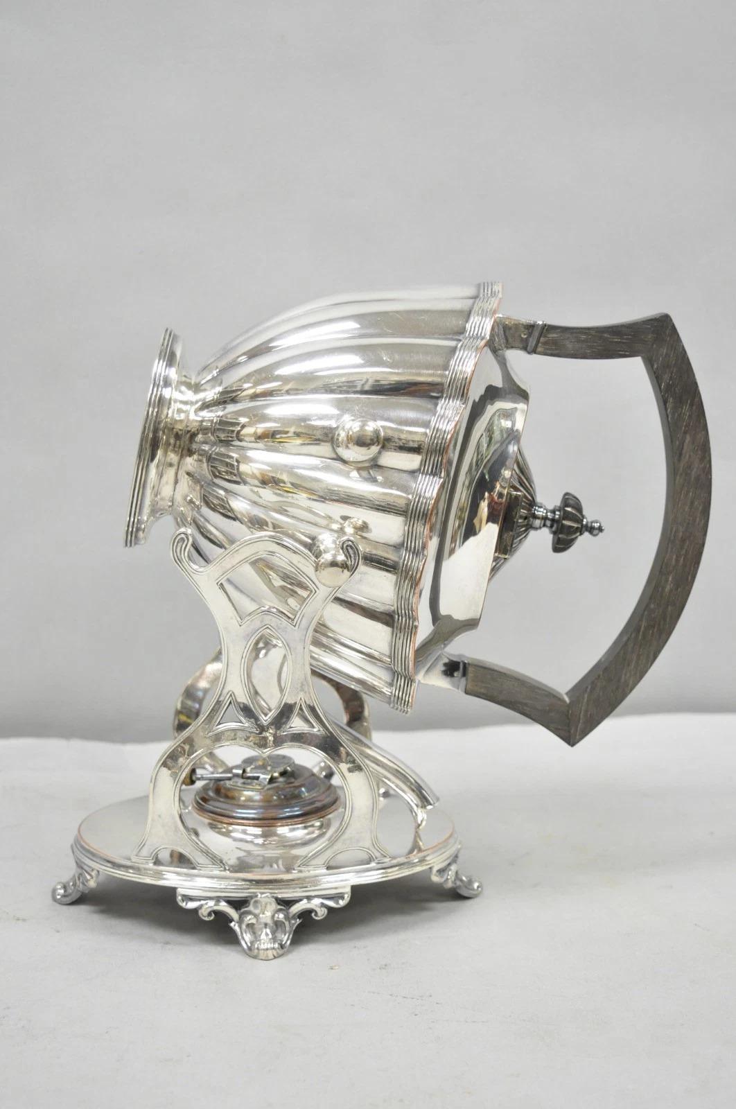 Antique English Art Nouveau Silver Plated Tilting Tea Kettle Pot on Stand. Circa Early 20th Century. Dimensions : 13