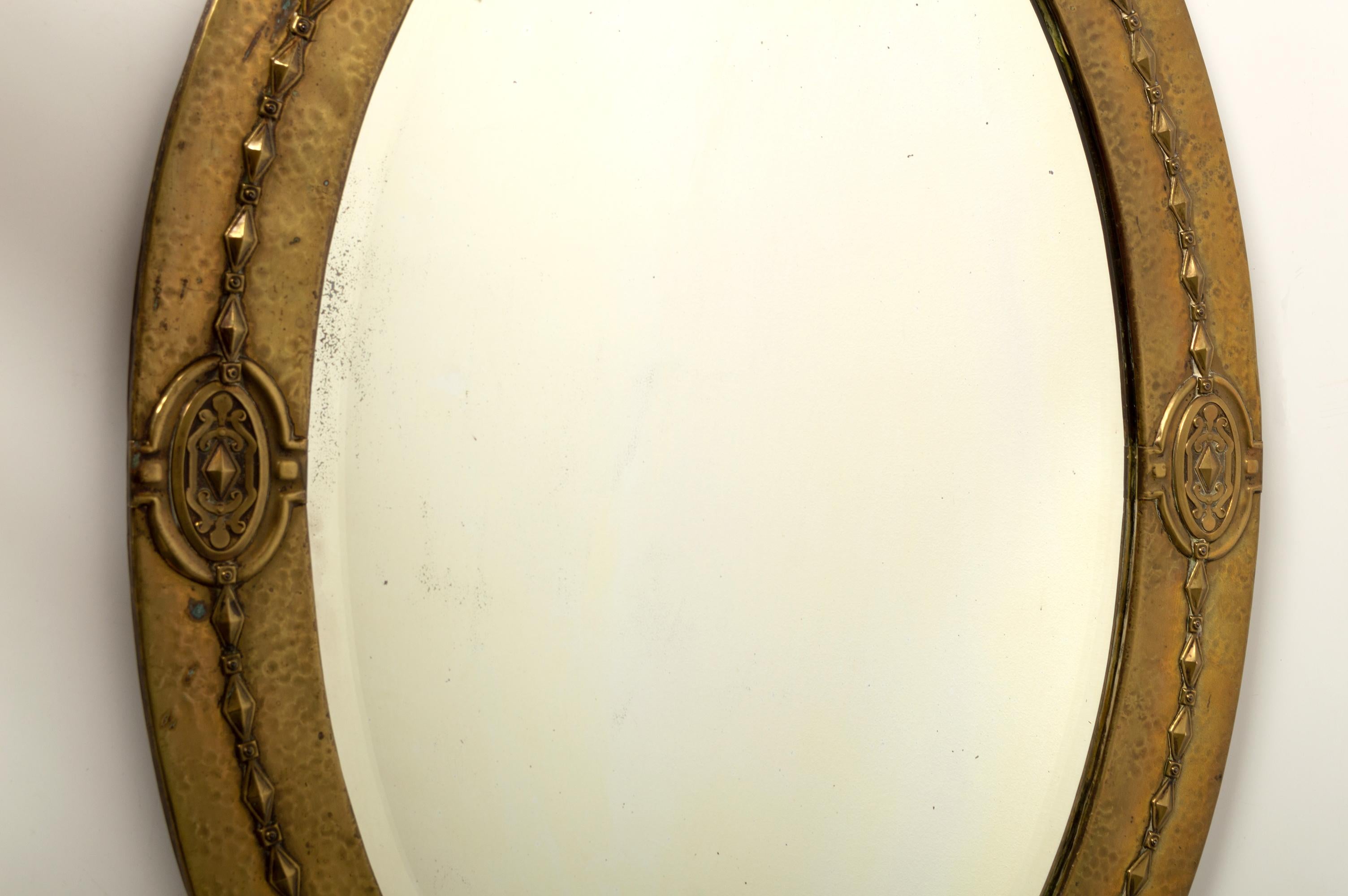Late 19th Century Antique English Arts And Crafts Liberty & Co Hammered Copper Oval Mirror C.1890 For Sale
