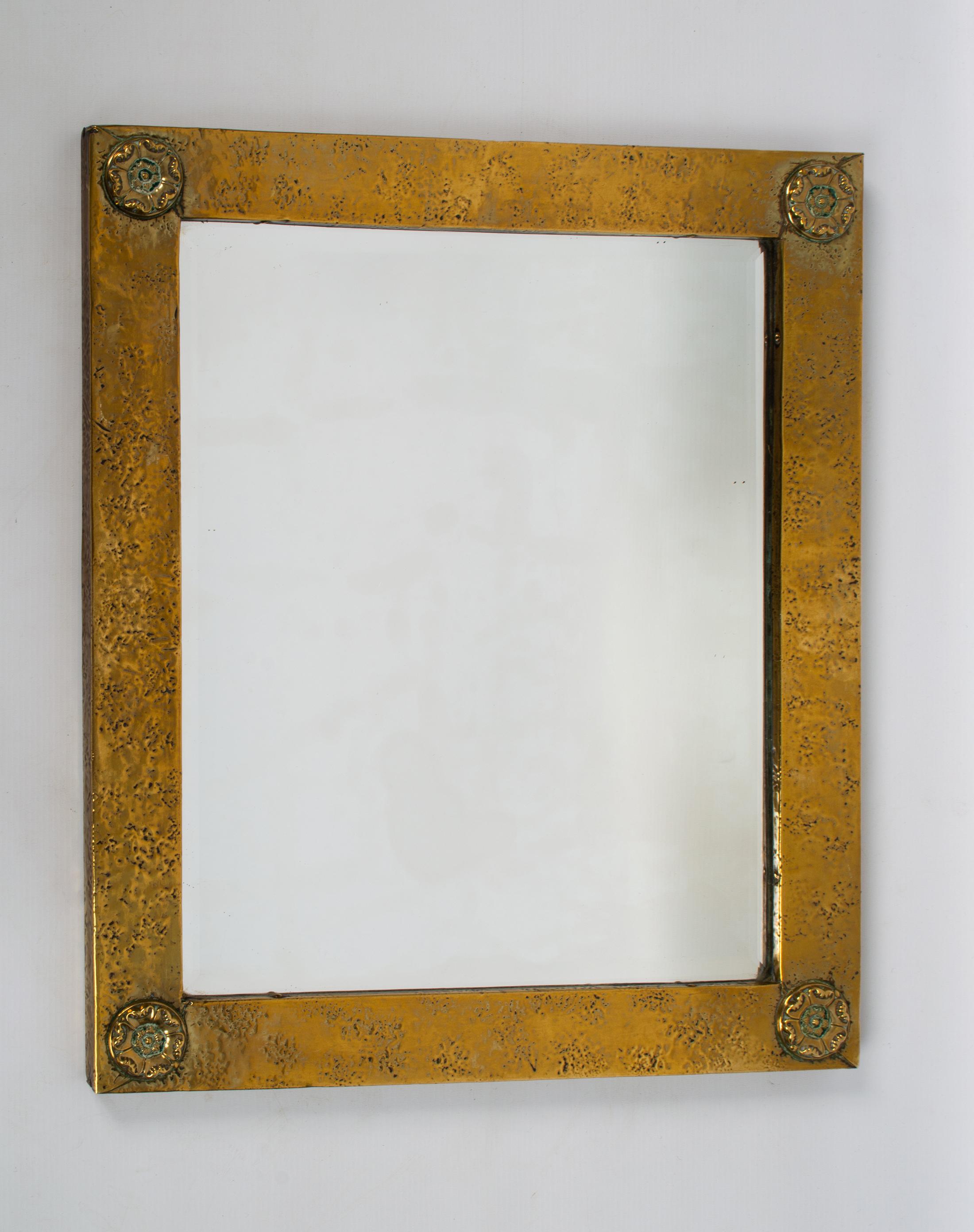 Antique English Arts And Crafts Polished brass mirror Liberty and Co London
C.1900
Hammered brass frame, bevelled mirror (good condition, no foxing).

Presented in excellent condition commensurate with age.