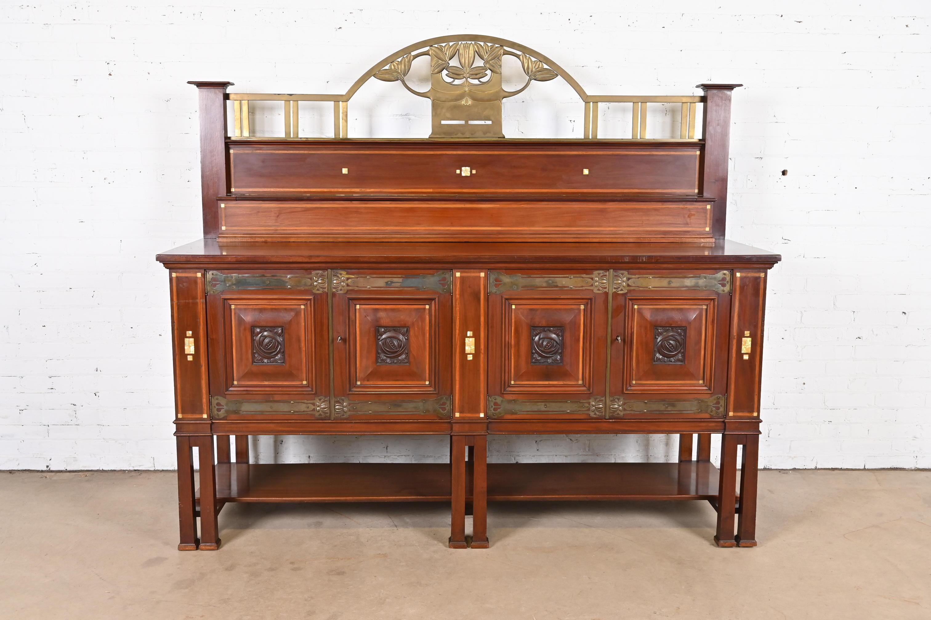 An exceptional English Arts & Crafts or Art Deco sideboard, buffet server, or bar cabinet

In the manner of Charles Rennie Mackintosh

By Robson & Sons

England, Circa 1900

Gorgeous mahogany, with Mackintosh-style carved roses, Mother-of-Pearl and