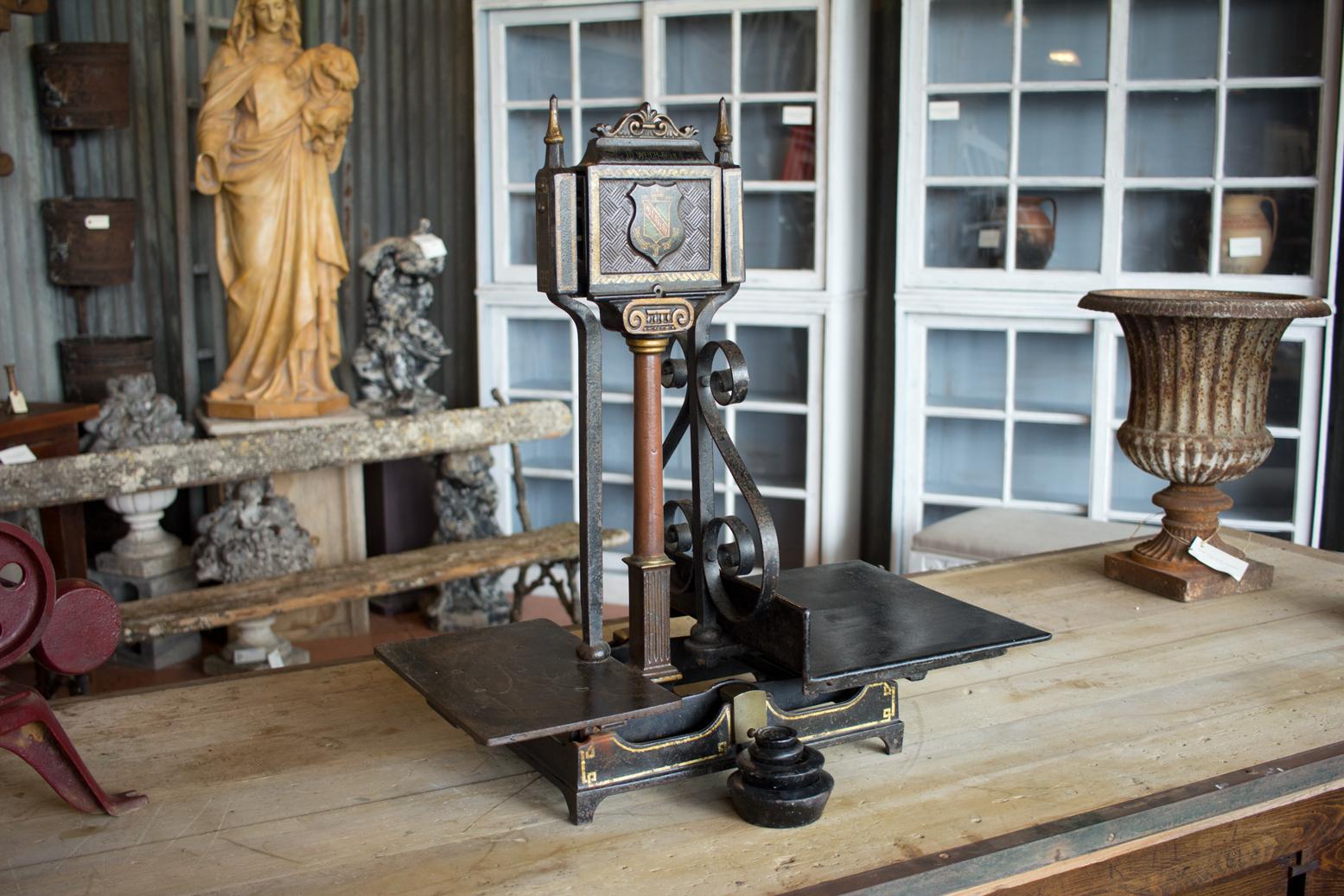 Antique balance scales with original paint and weights. The front has a crest of the Royal Warranted Coat of Arms inscribed W & T Avery, Birmingham, England.

The company was founded in the early 1700s and took the name W & T Avery in 1818.