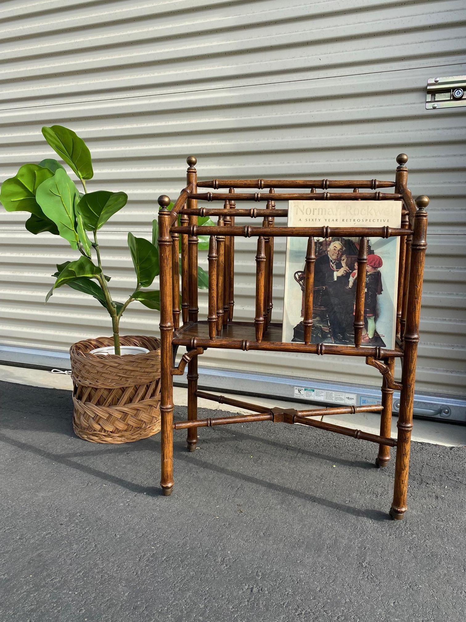 This is a gorgeous antique bamboo magazine rack on caster wheels. Very unique in design. Perfect for storing your magazines or record albums.