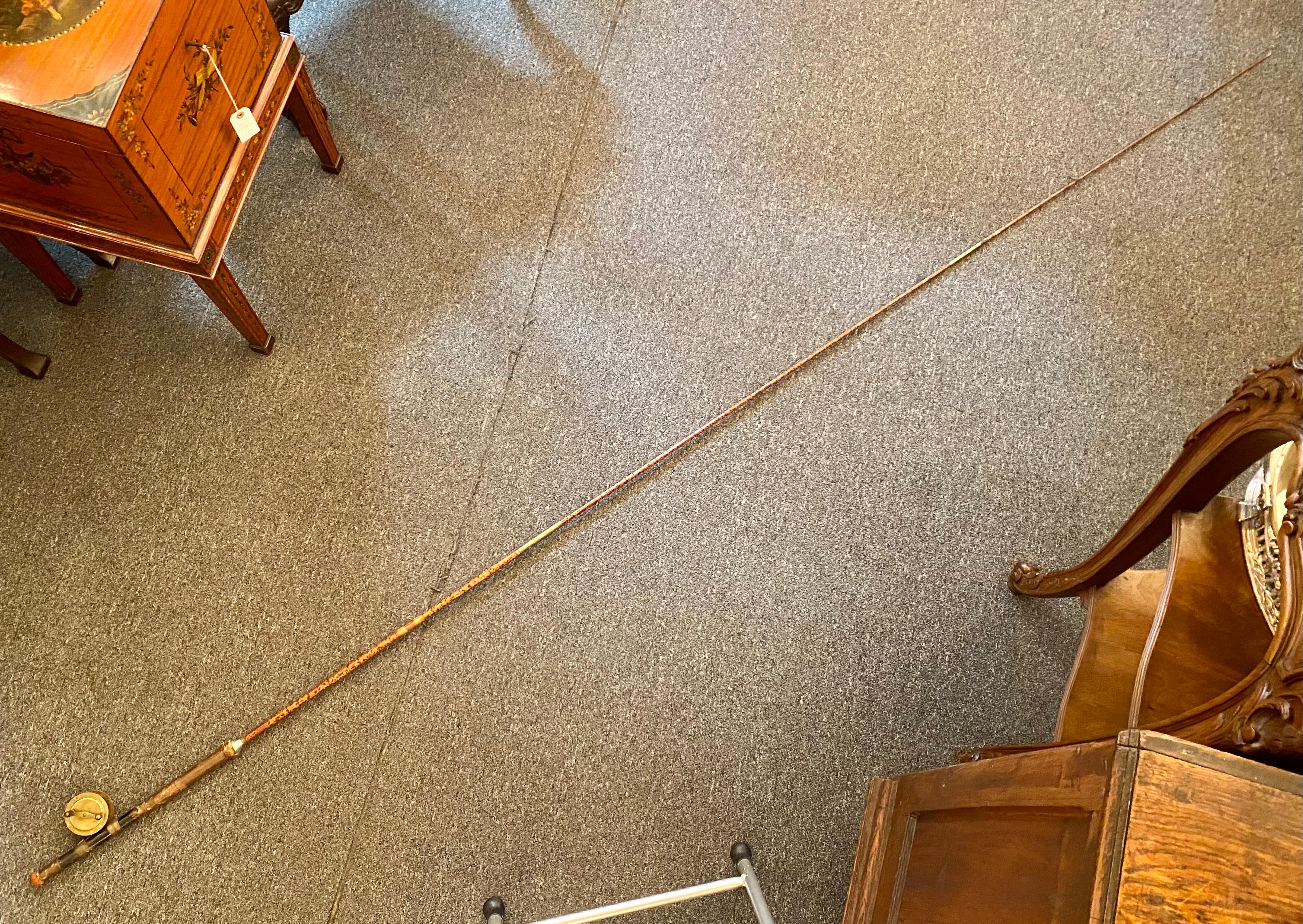 Antique English bamboo fly fishing rod with reel, Circa 1920's. The fishing rod comes apart in 3 pieces.
Overall: 114