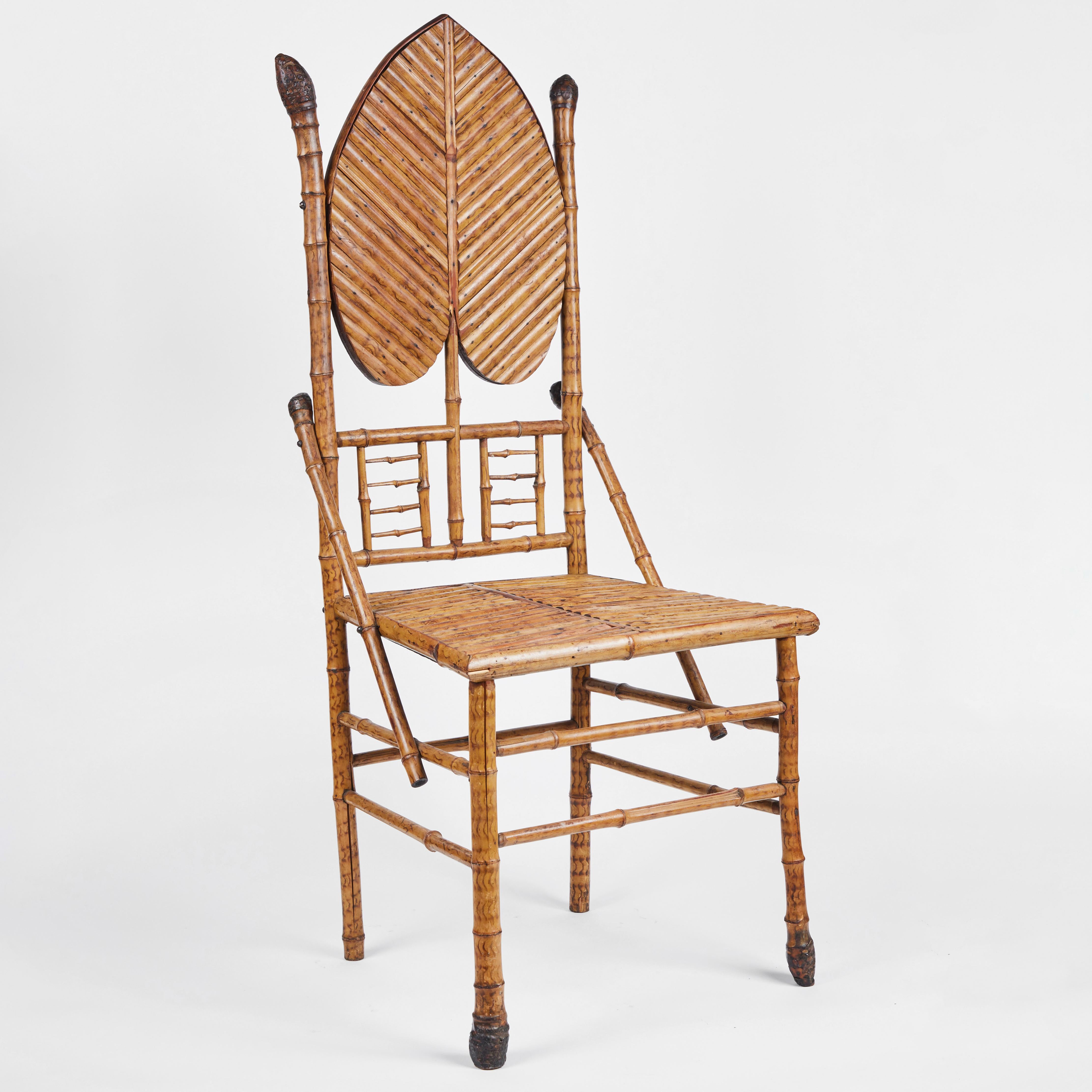Antique English bamboo side chair with leaf motif and split bamboo seat.

Measures: 19.5