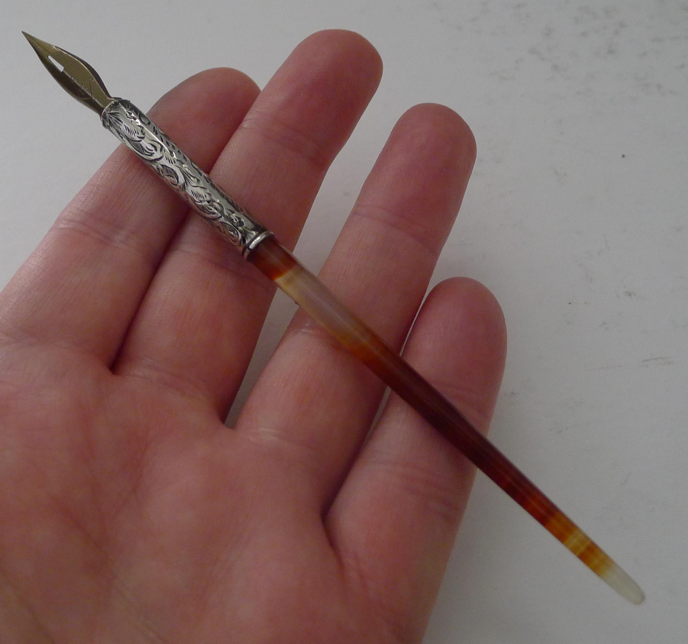 A stunning little Victorian dip pen with a banded agate handle and solid sterling silver terminal with bright cut decoration.  

The silver is fully hallmarked for the highly collectable Chester assay office and struck in the year 1894.

Very good