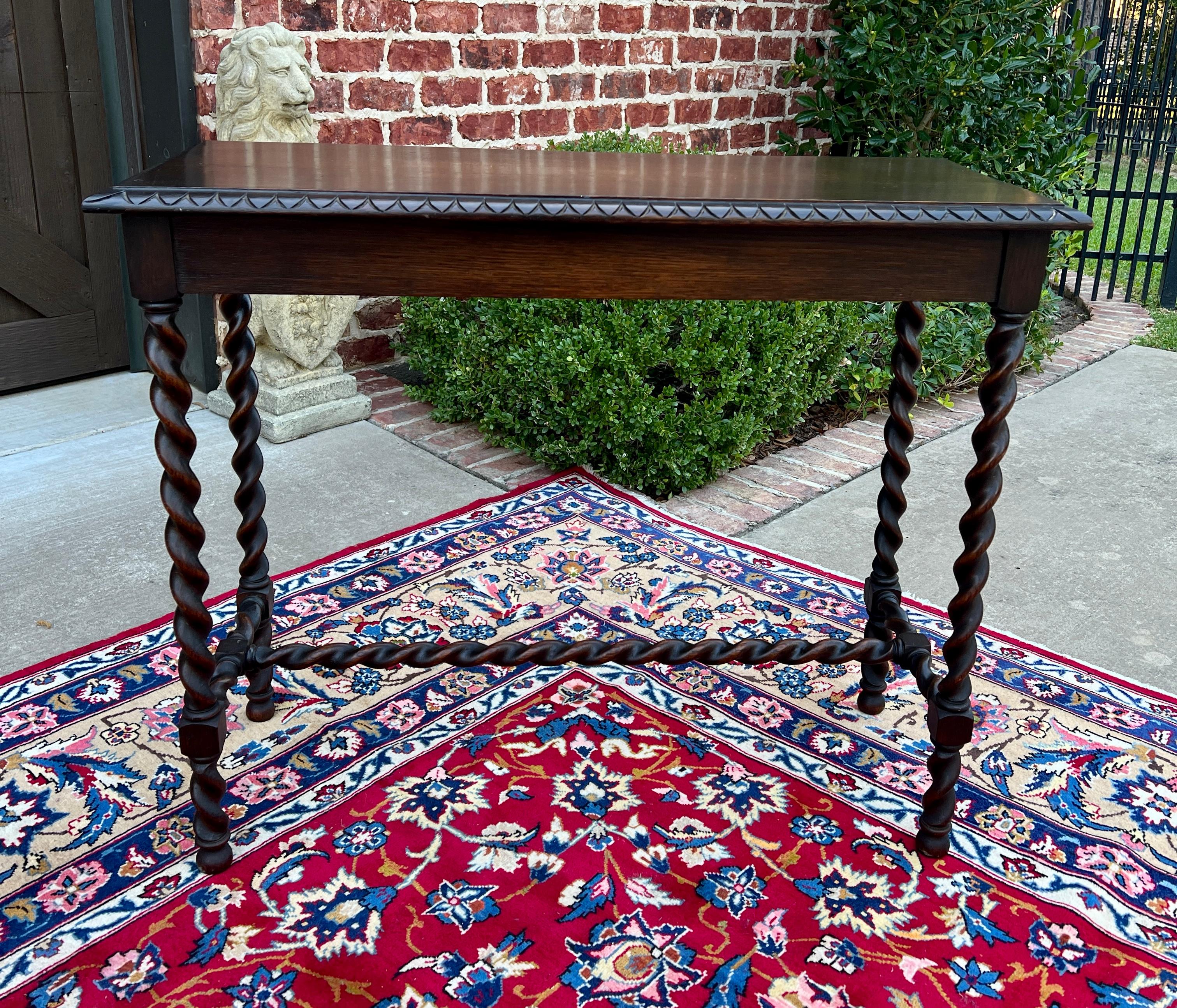 Antique English Oak Jacobean Sofa Table, Entry Table, Barley Twist Legs and Stretcher with Carved Edge Top
~~c. 1920s 

Barley twist legs and stretcher ~~Versatile~~perfect for any office, den, library, entry hall, or use as a sofa table!

Versatile