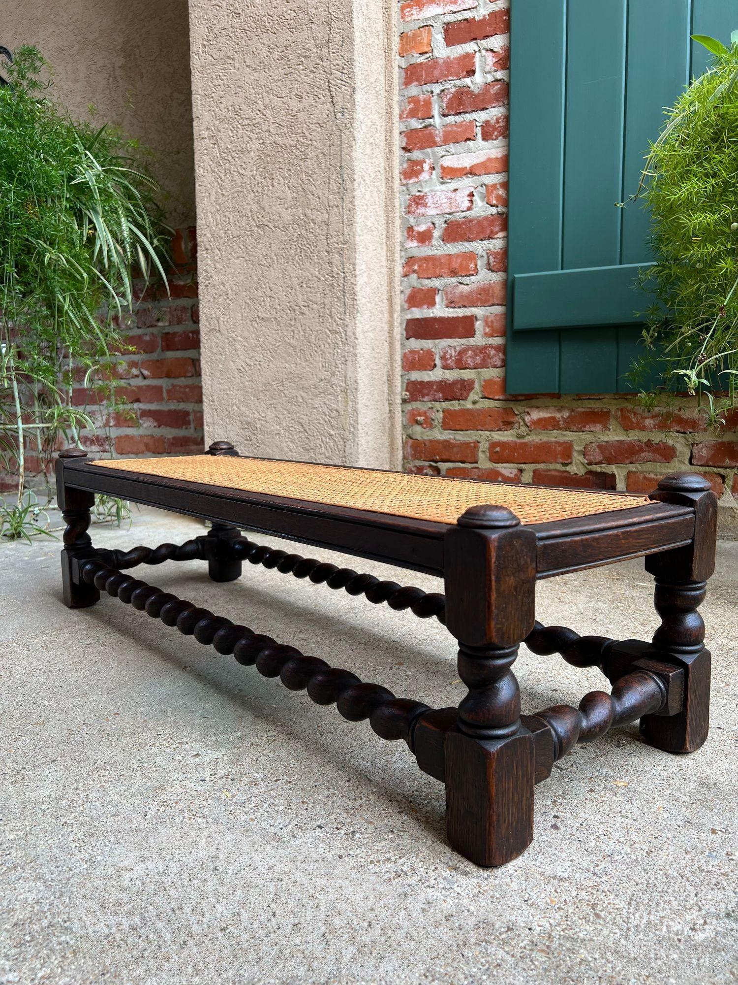 Antique English Barley Twist Stool Bench Oak Cane Jacobean Ottoman c1920.

Direct from England, a long and lovely antique English oak bench with beautiful features that include barley twist legs and full length barley twist stretchers as well as the