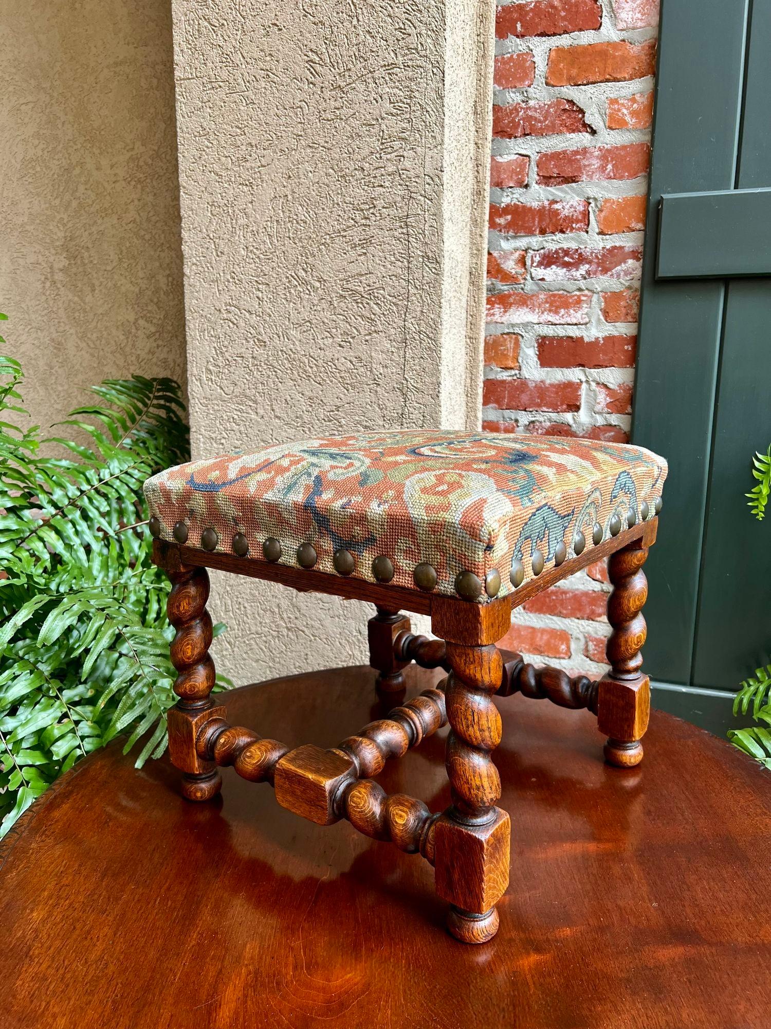 Antique English Barley Twist Stool Bench Oak Tapestry Needlework Square c1900.

Direct from England, another superb antique English oak stool with beautiful features that include barley twist legs and barley twist stretchers and cross stretchers.