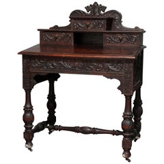 Antique English Baroque Heavily Foliate Carved Slant-Front Plantation Desk