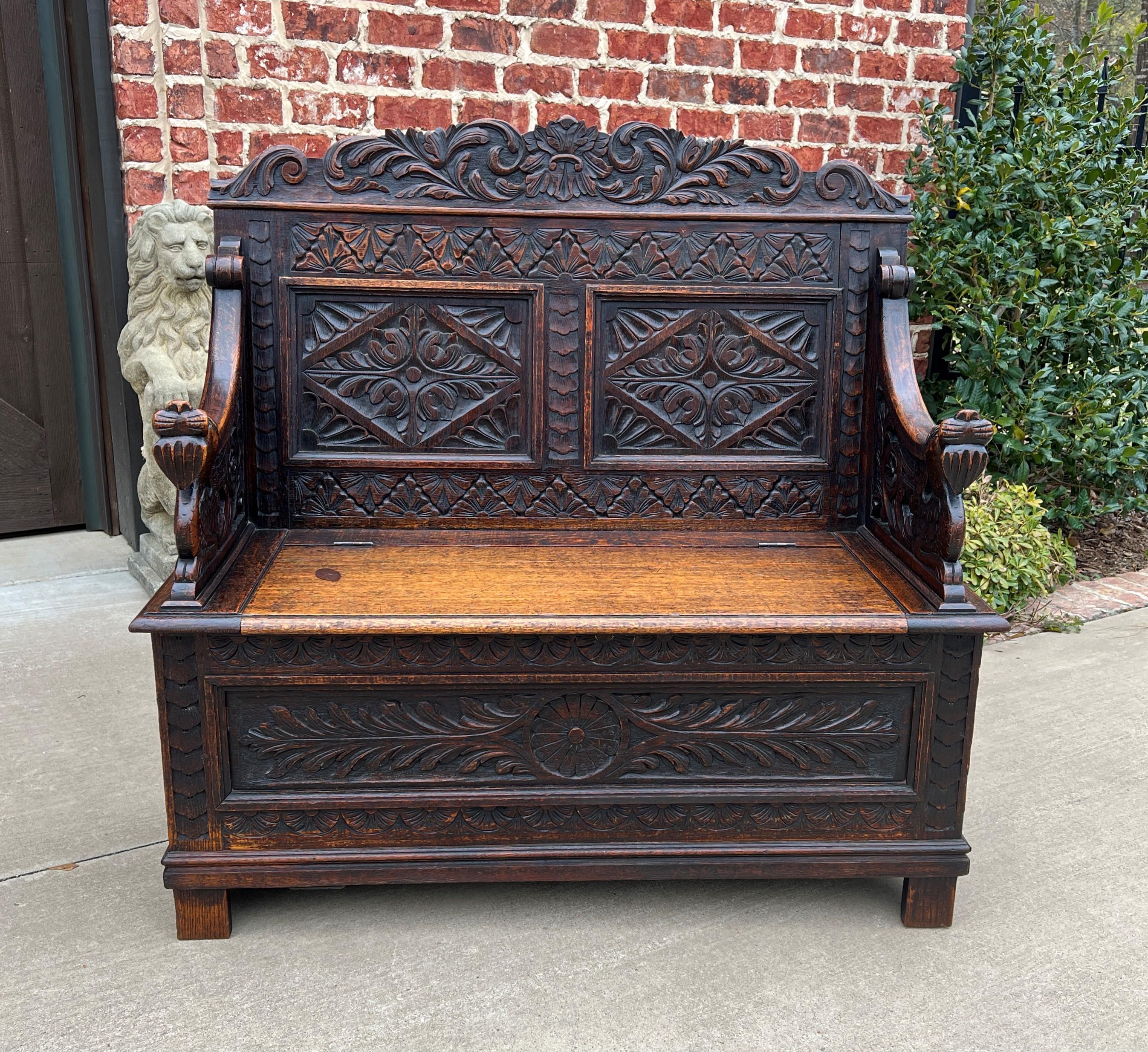 Charming antique English oak petite renaissance revival hall seat, bench or chair~~highly carved ~~circa
1880s.
Hard-to-find petite size~~wonderful 